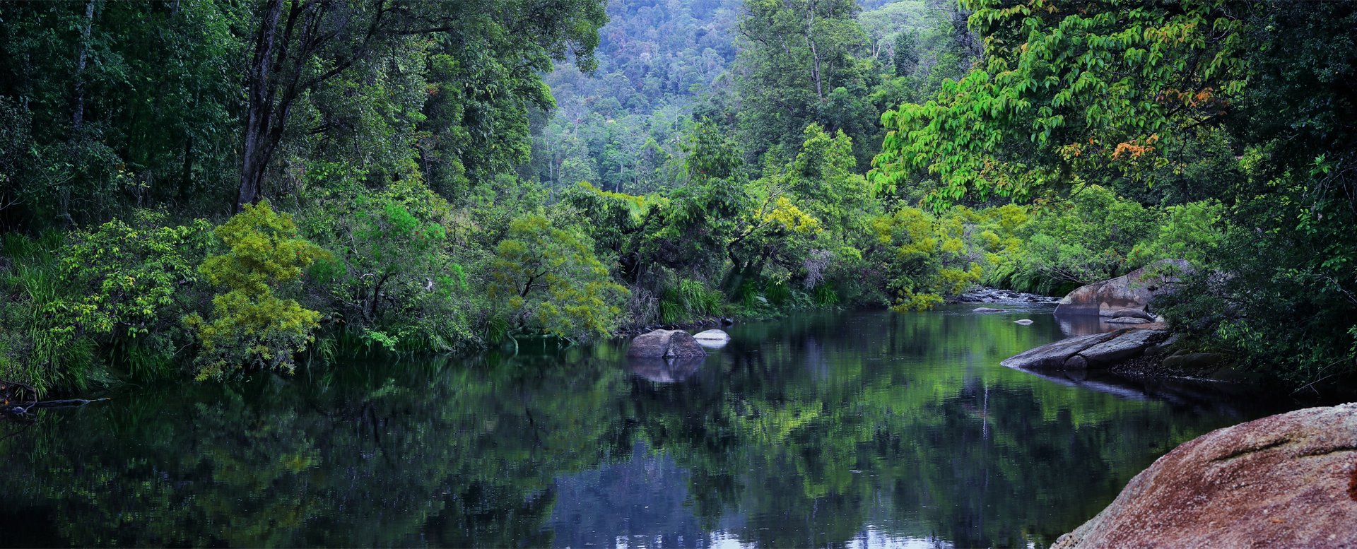 body of water near mountain