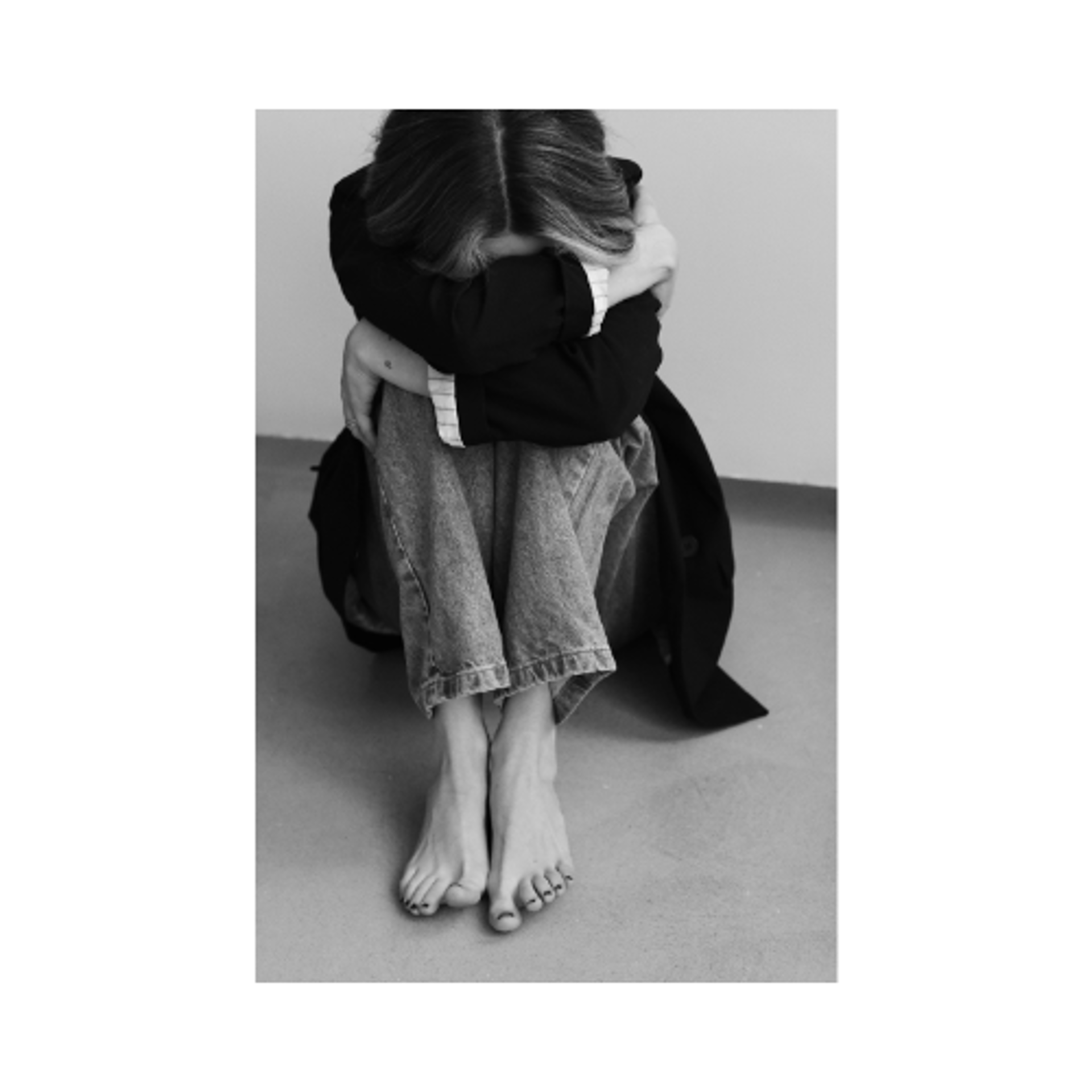 an abstract photo of a curved building with a blue sky in the background