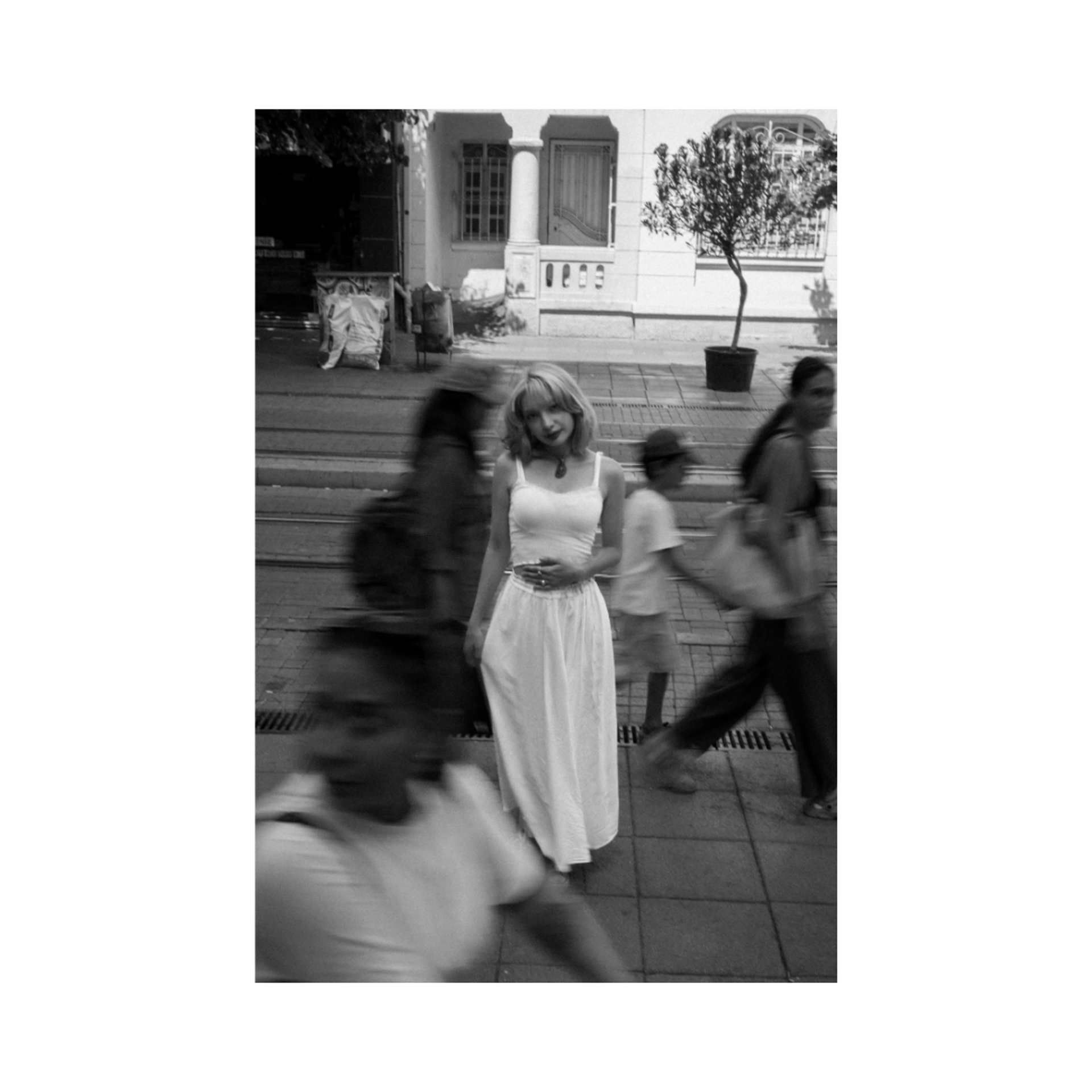 an abstract photo of a curved building with a blue sky in the background