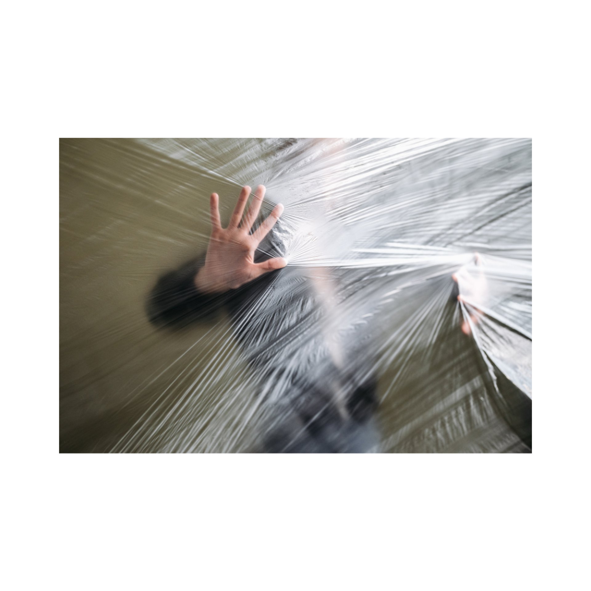 an abstract photo of a curved building with a blue sky in the background