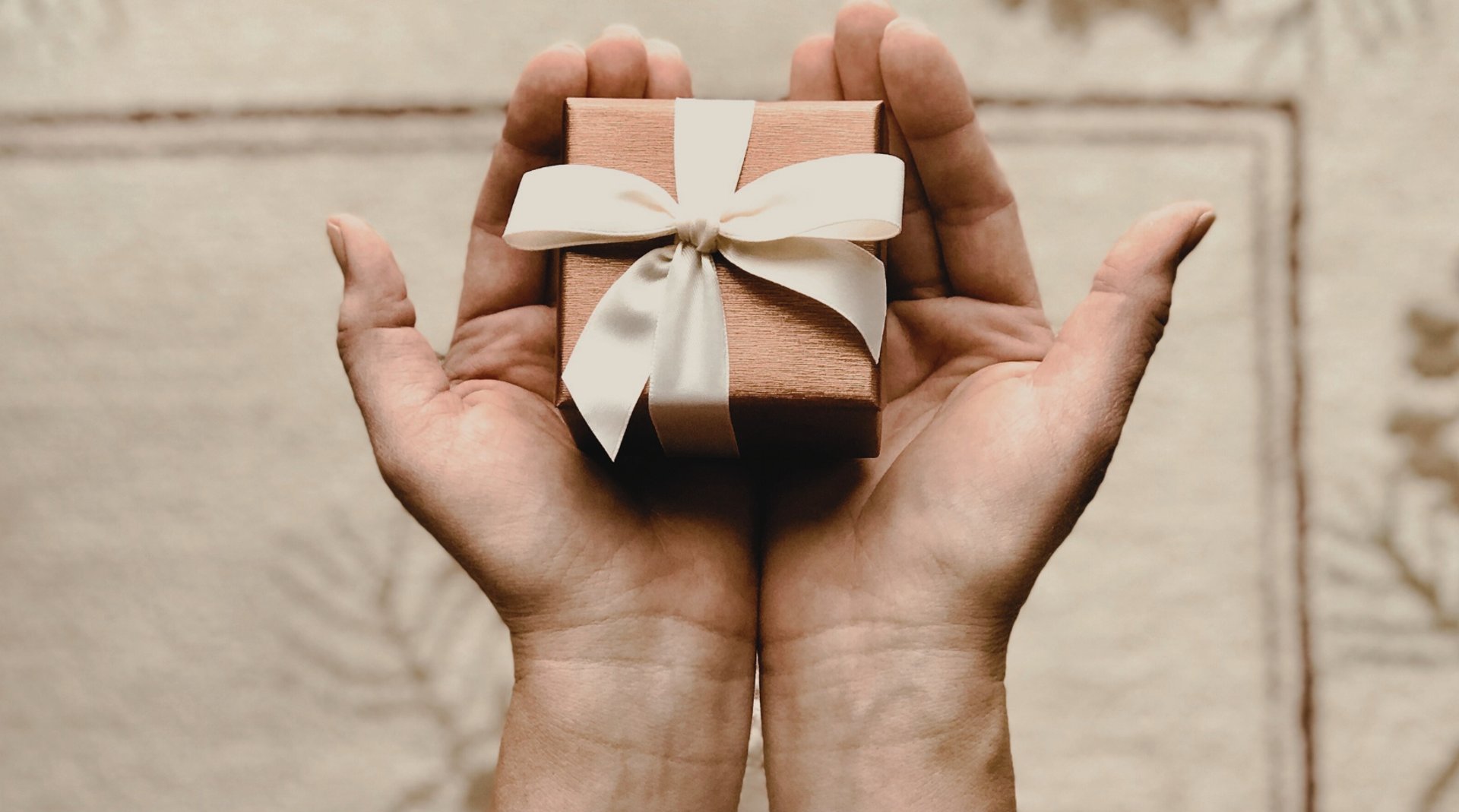 white envelop and gray pencil on white panel