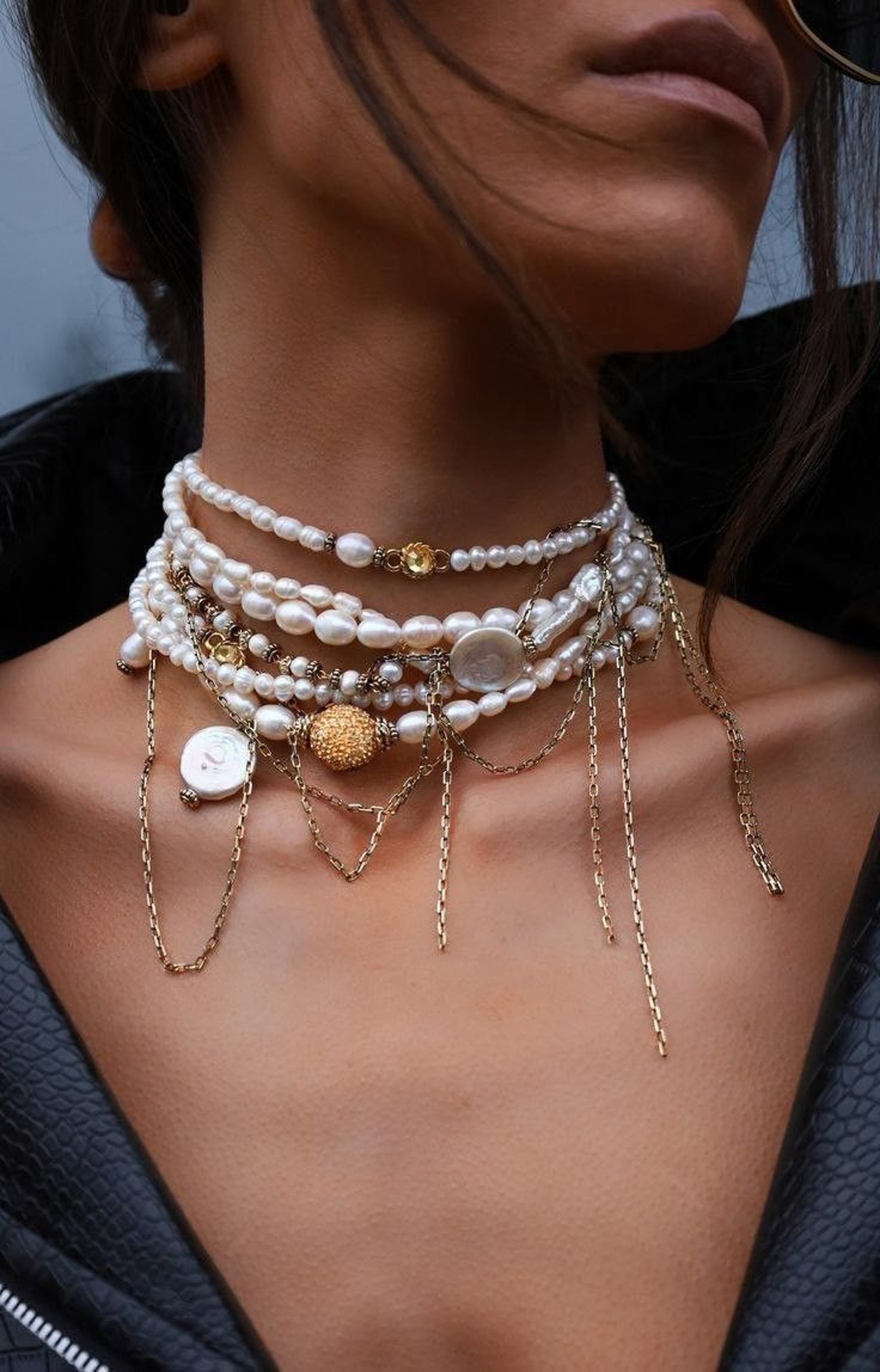 woman wearing silver and white pearl earring