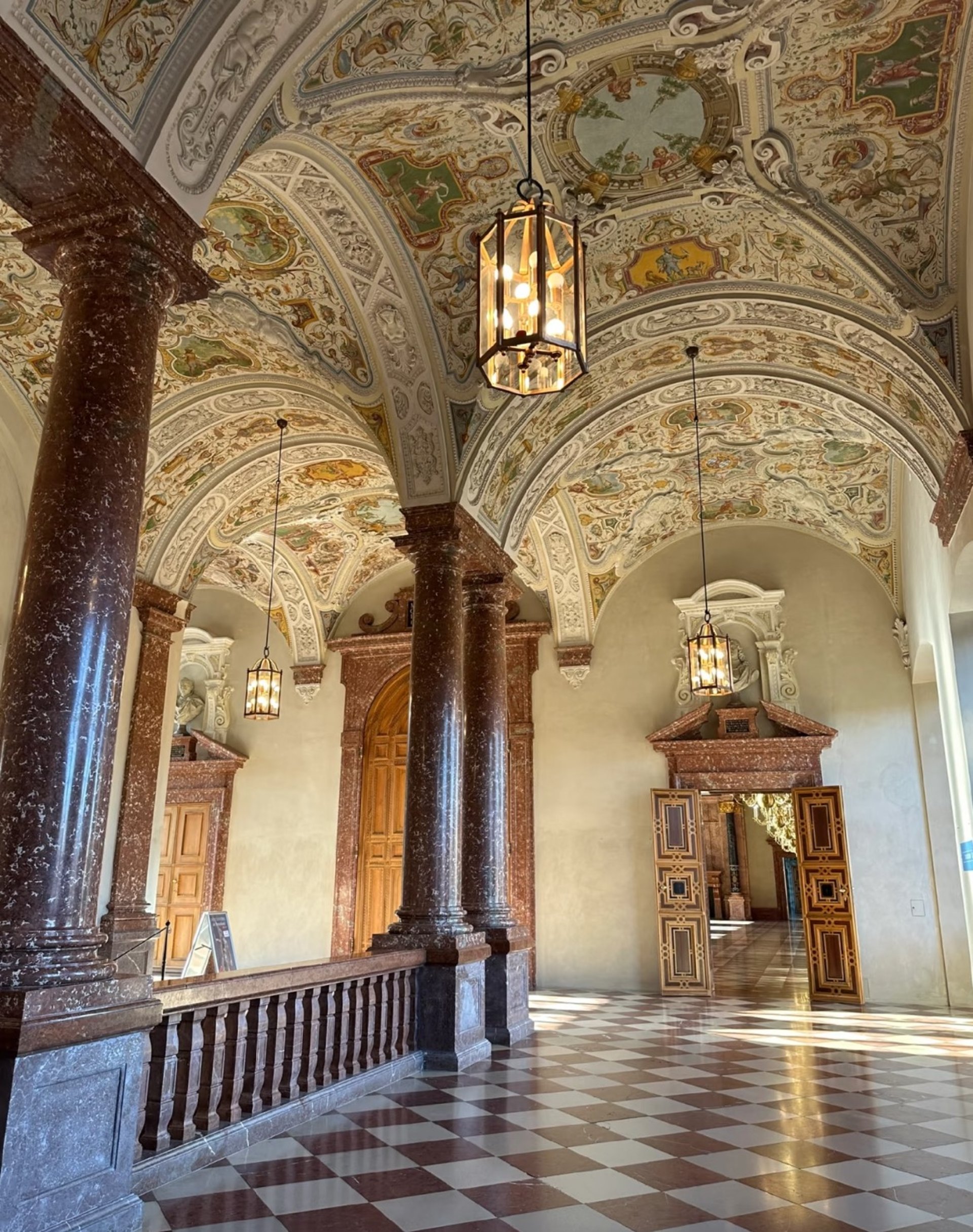 man and woman standing in front of brown concrete building during daytime