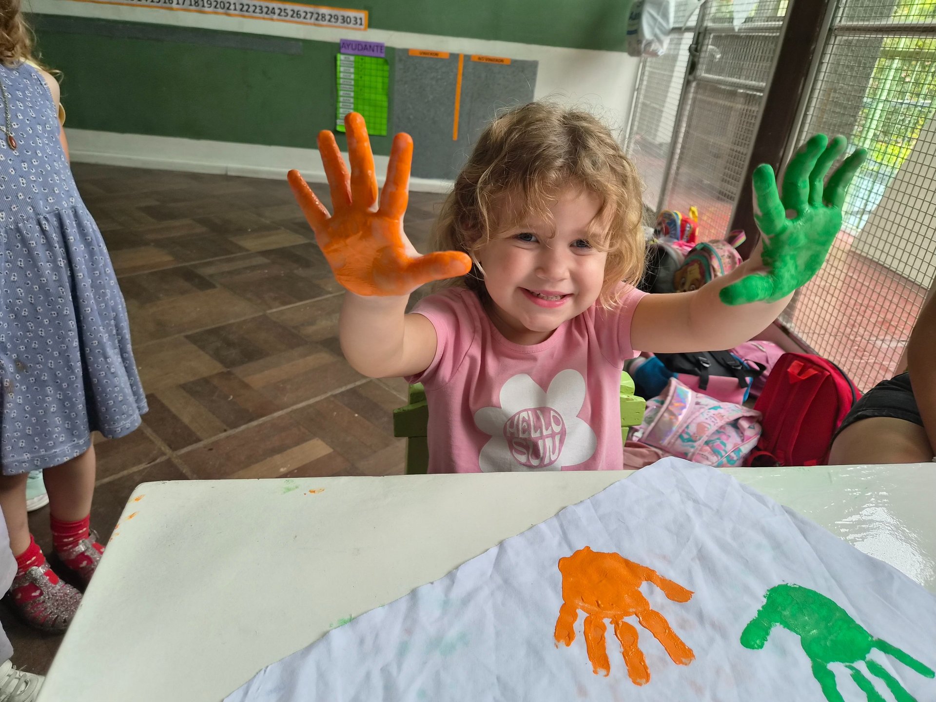 person holding red and white pen