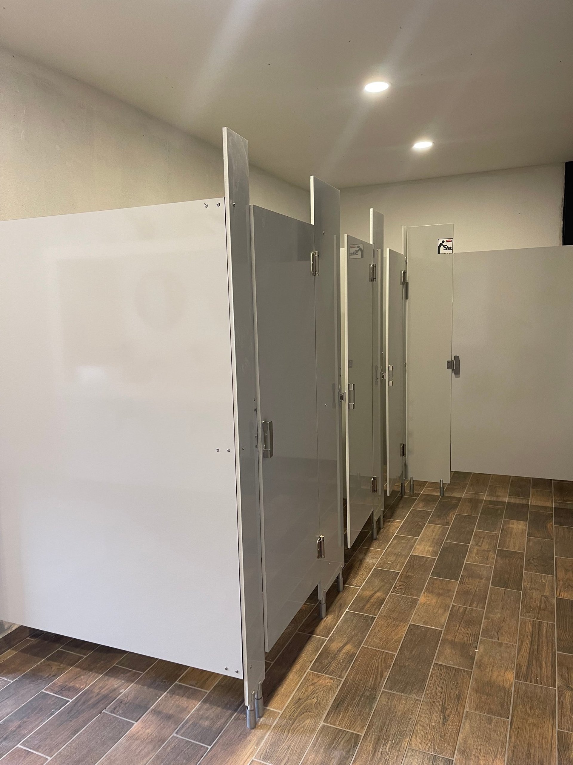 two people drawing on whiteboard