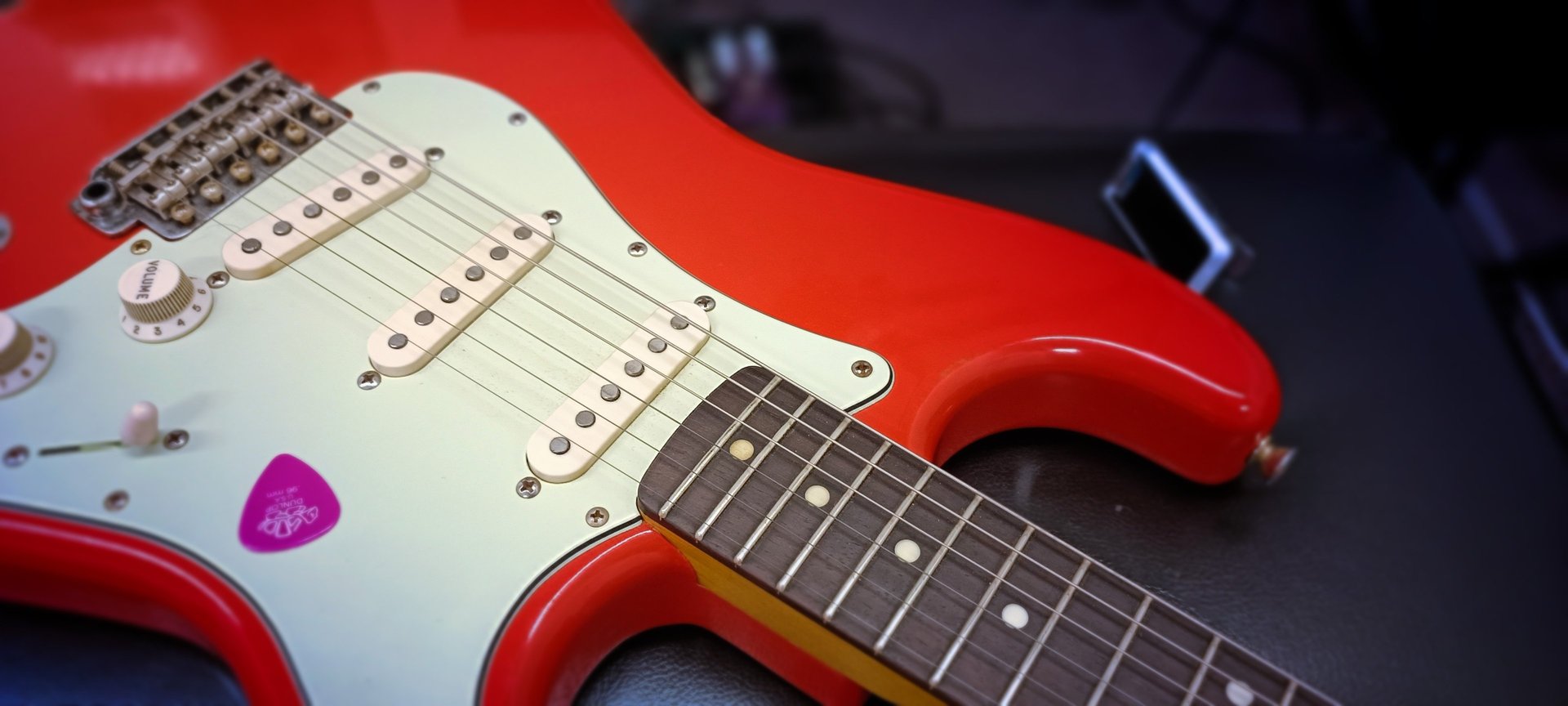 an abstract photo of a curved building with a blue sky in the background