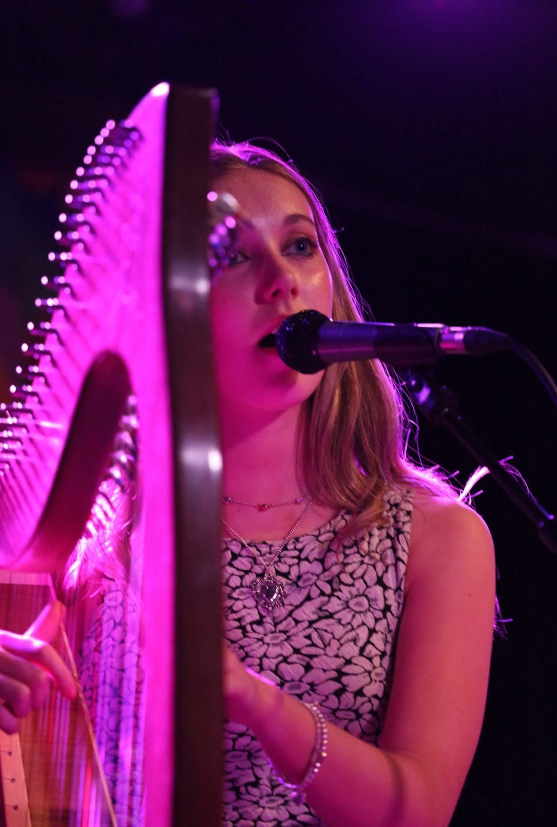 an abstract photo of a curved building with a blue sky in the background
