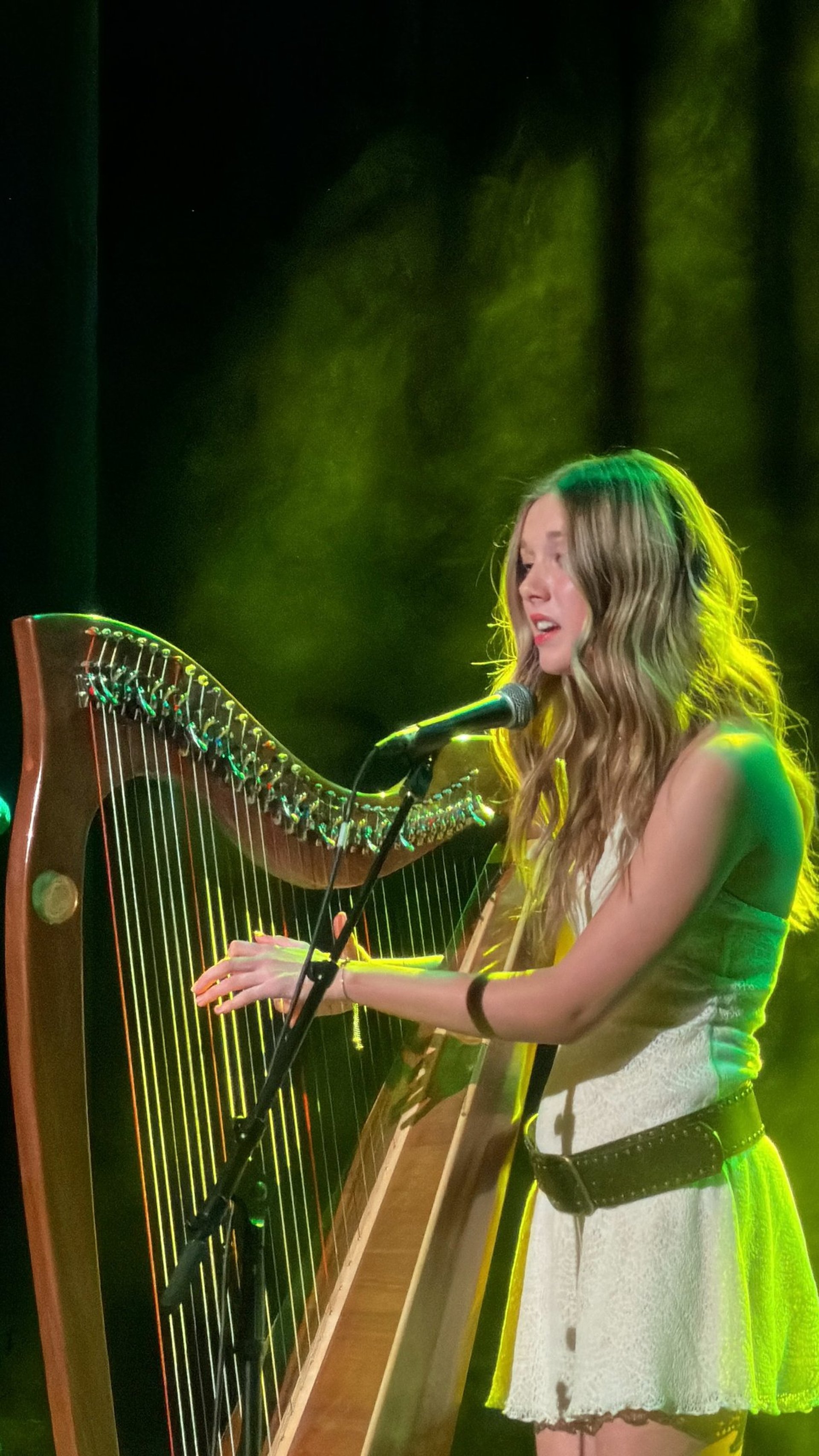 an abstract photo of a curved building with a blue sky in the background