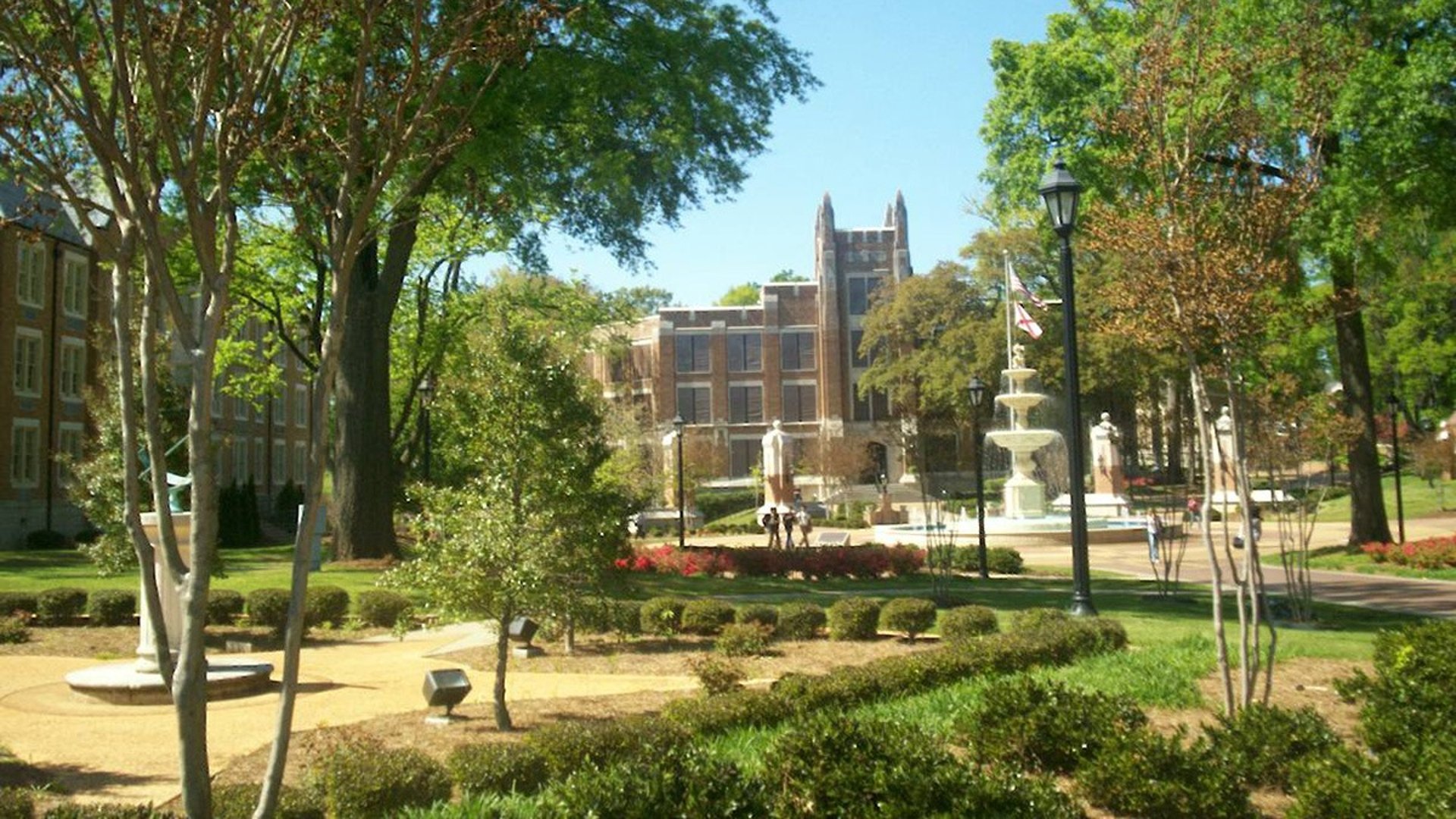 orange painted castle with green grass field scnery