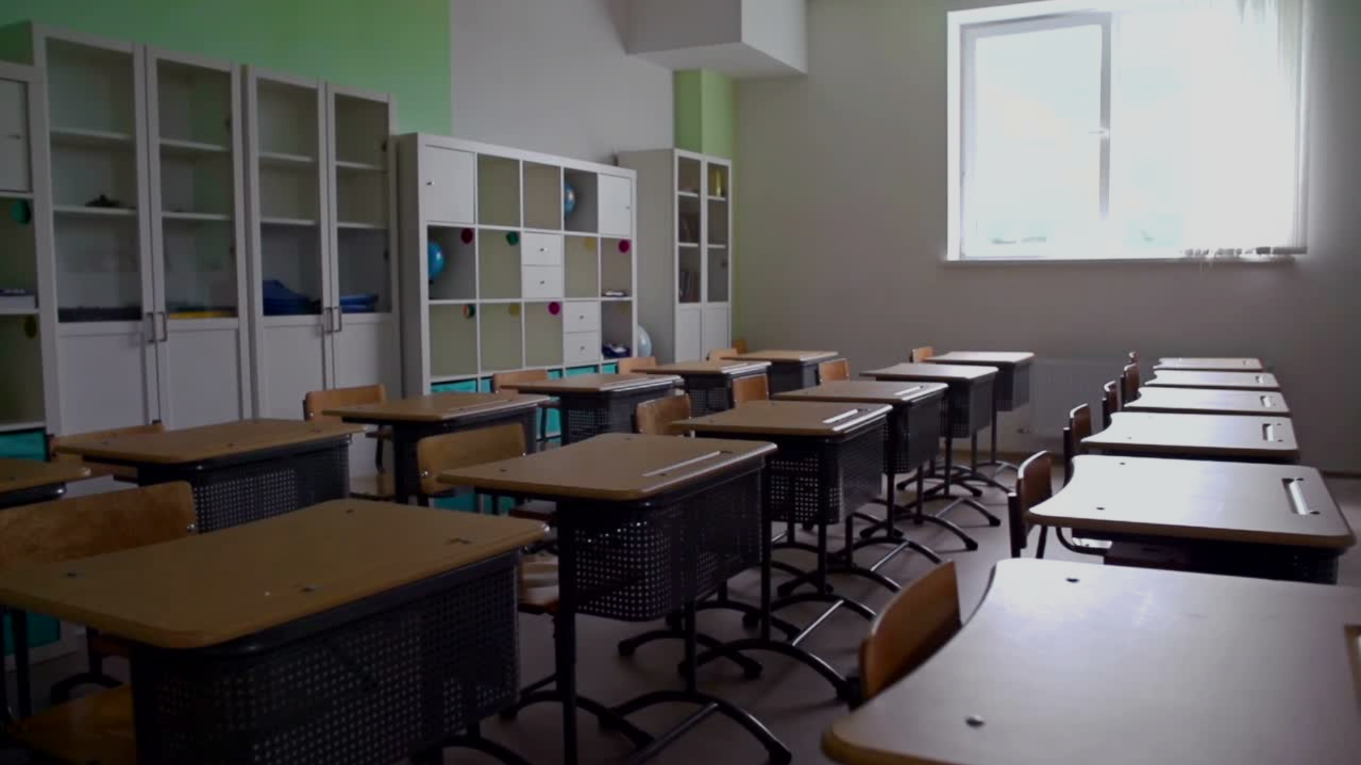 green grass field under white clouds and rainbow