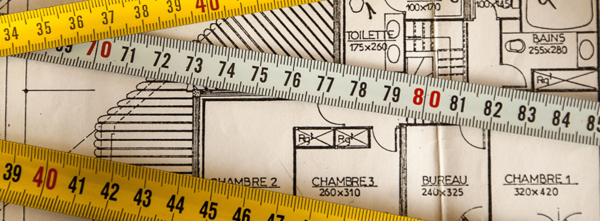 an abstract photo of a curved building with a blue sky in the background