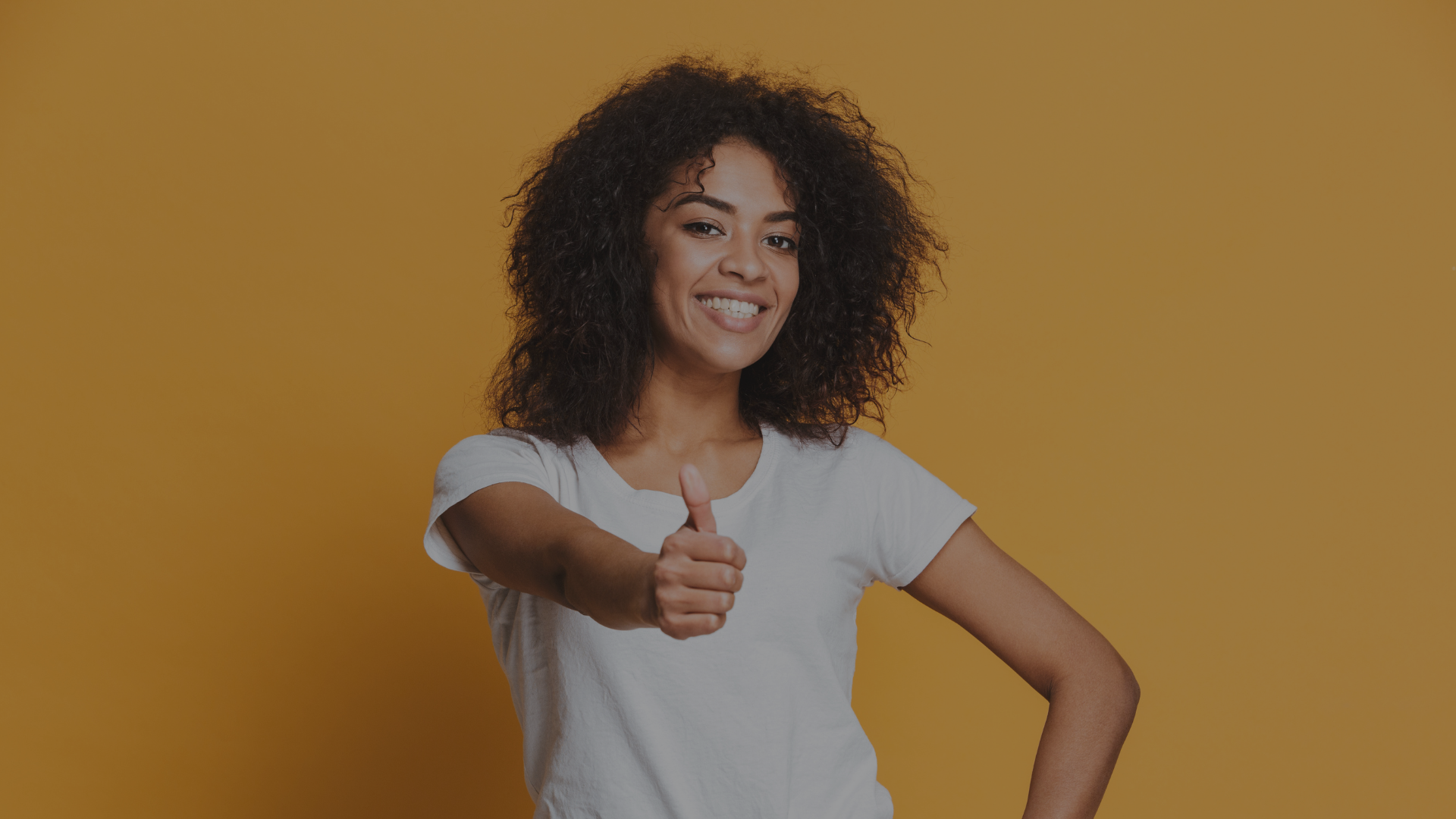 woman in white crew neck shirt smiling