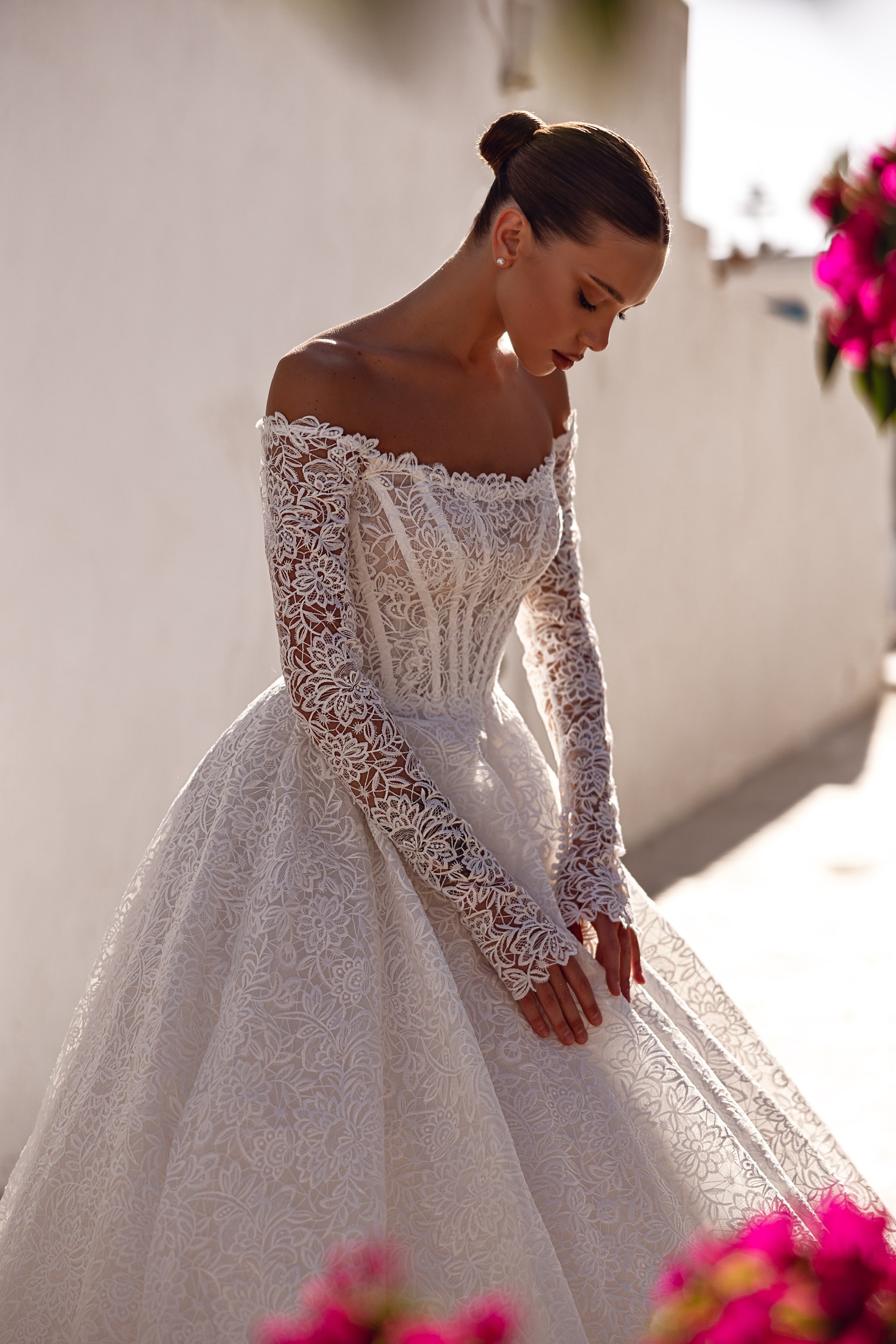 an abstract photo of a curved building with a blue sky in the background