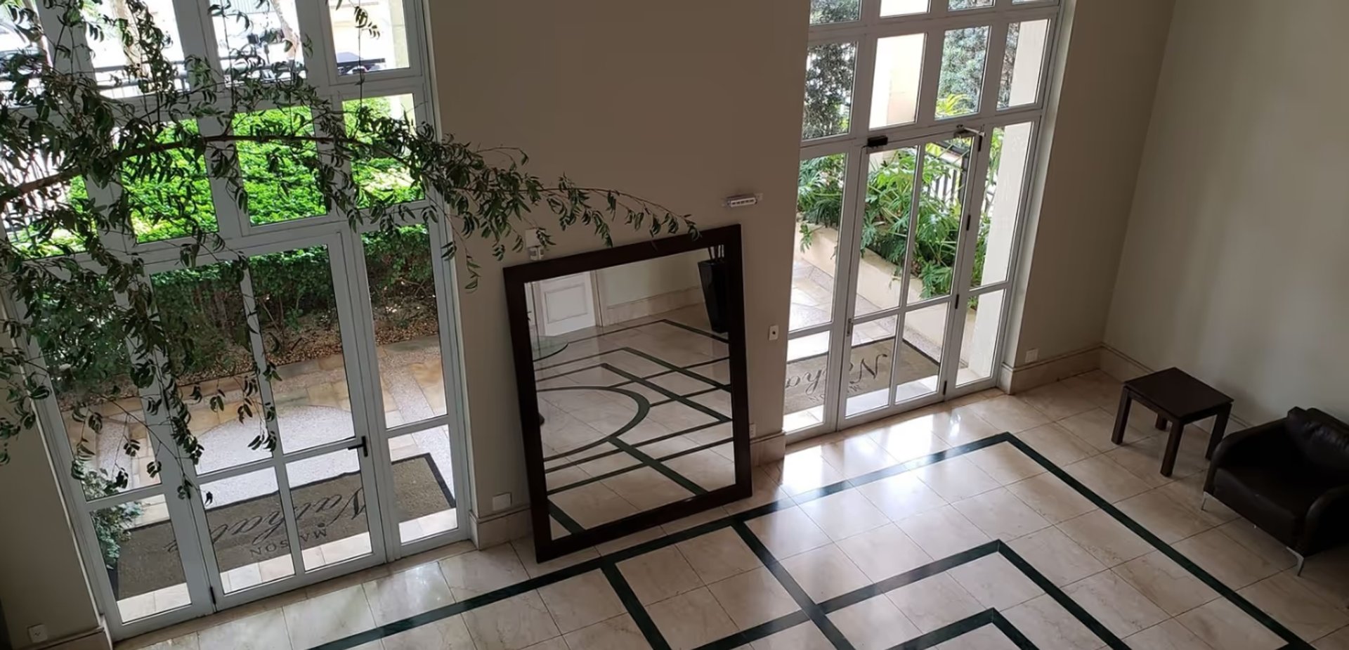 black and brown leather padded tub sofa