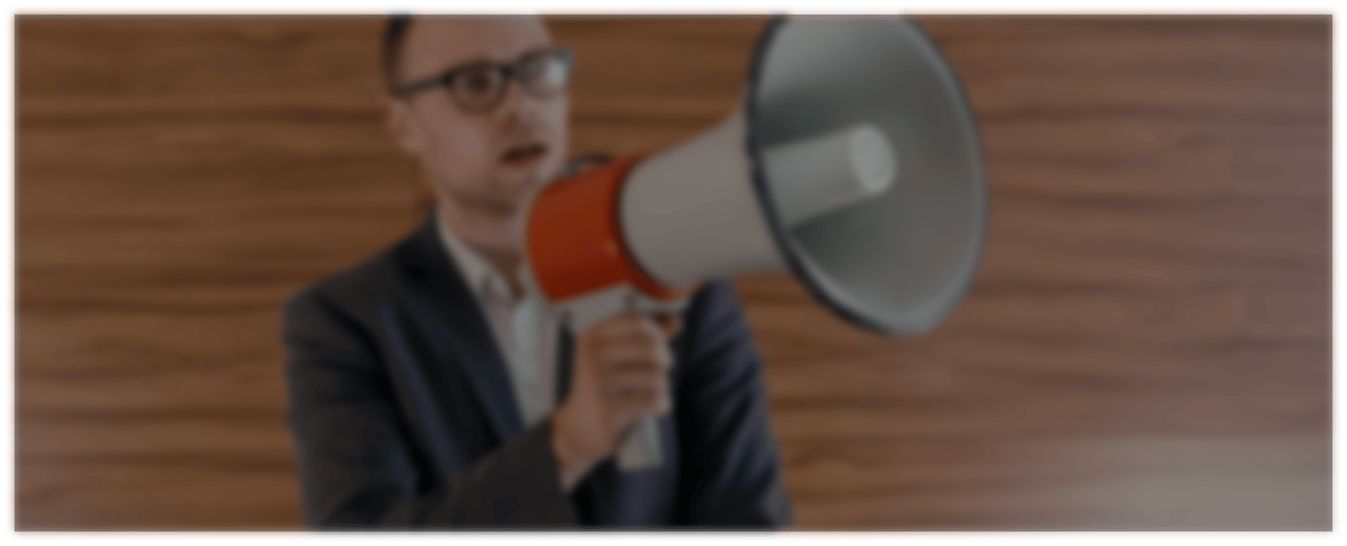 an abstract photo of a curved building with a blue sky in the background