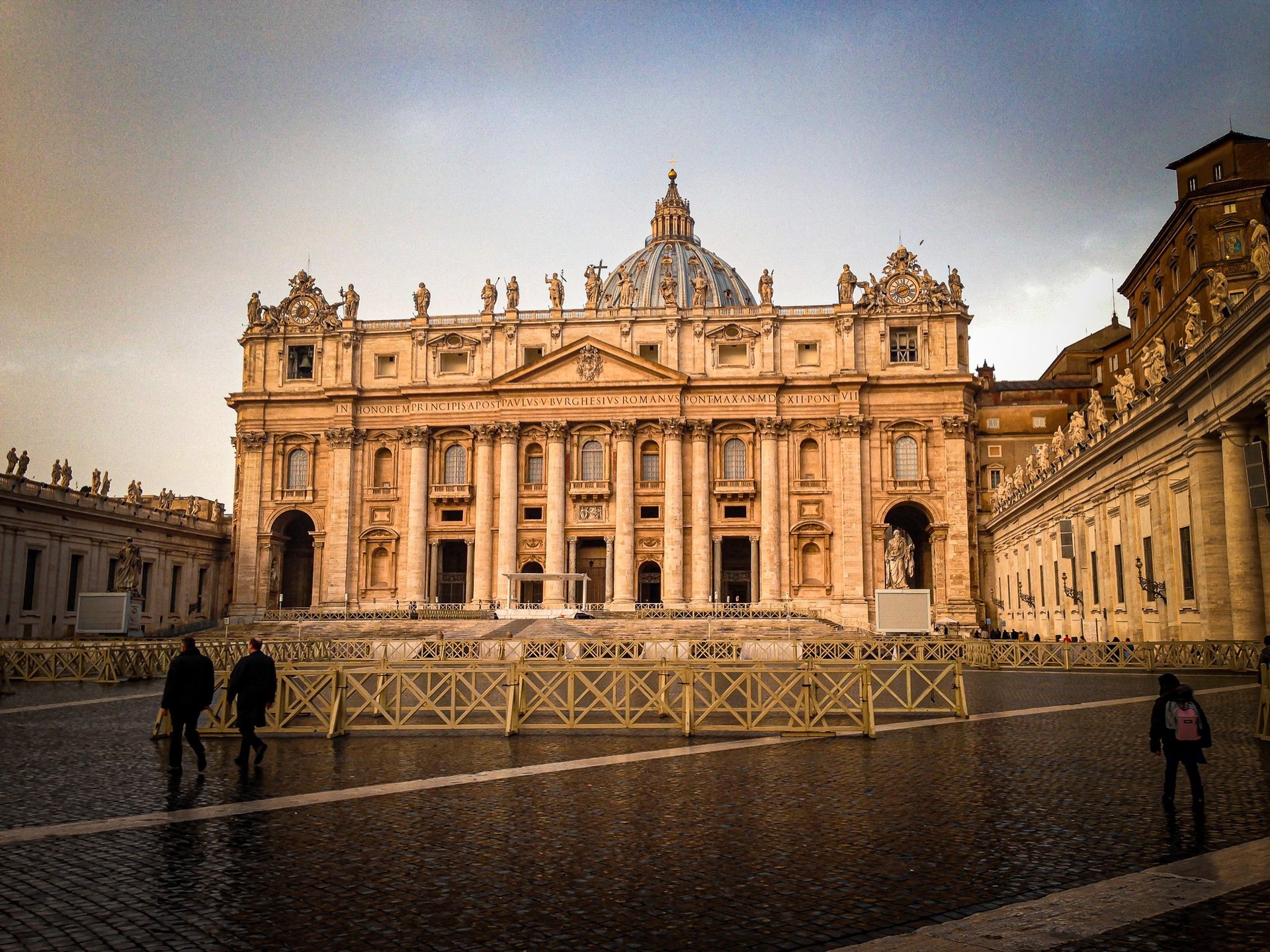 an abstract photo of a curved building with a blue sky in the background