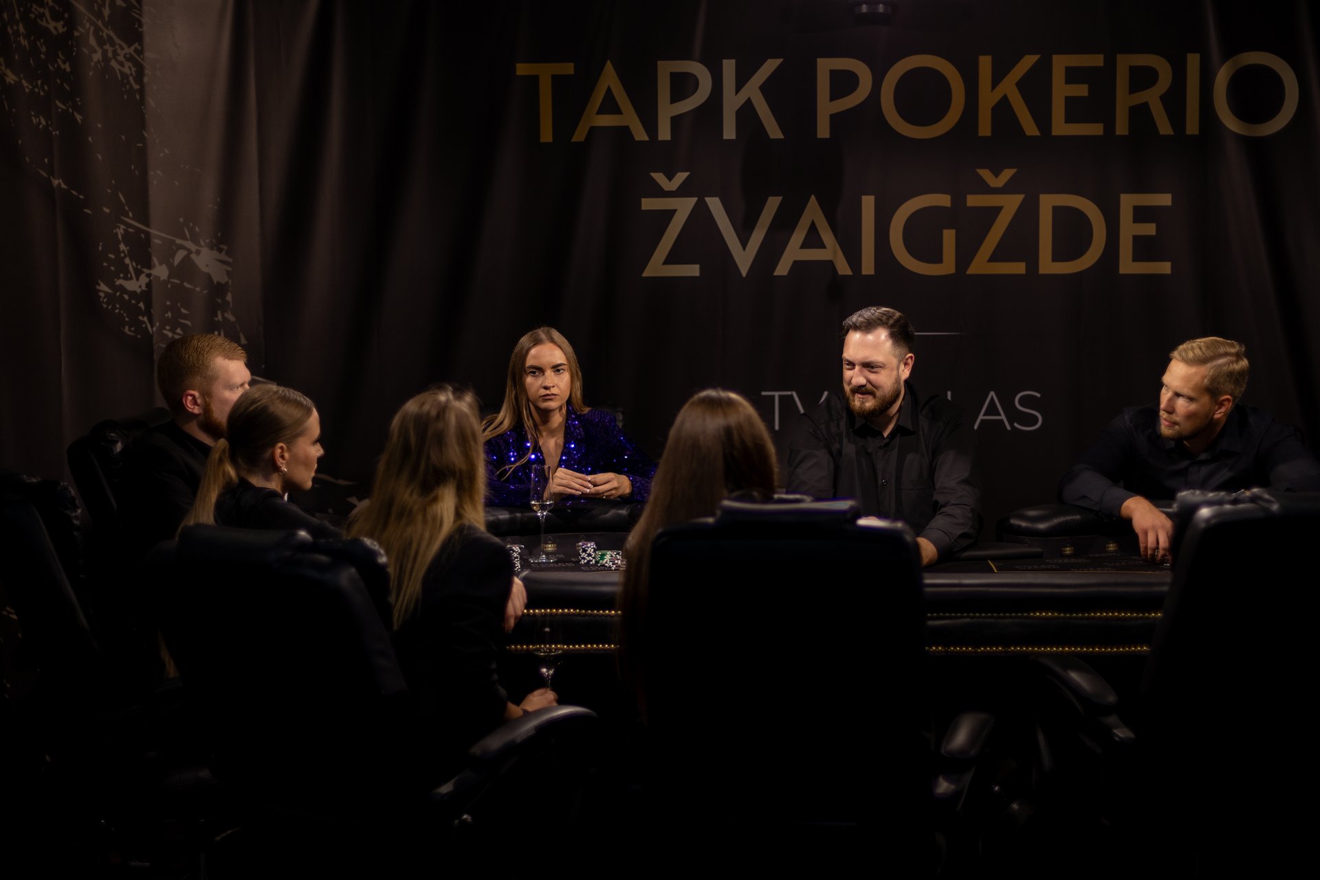 stainless steel round table on brown wooden table