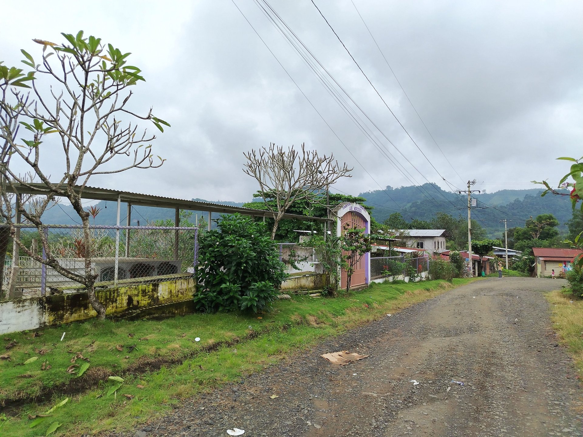 woman wearing yellow long-sleeved dress under white clouds and blue sky during daytime