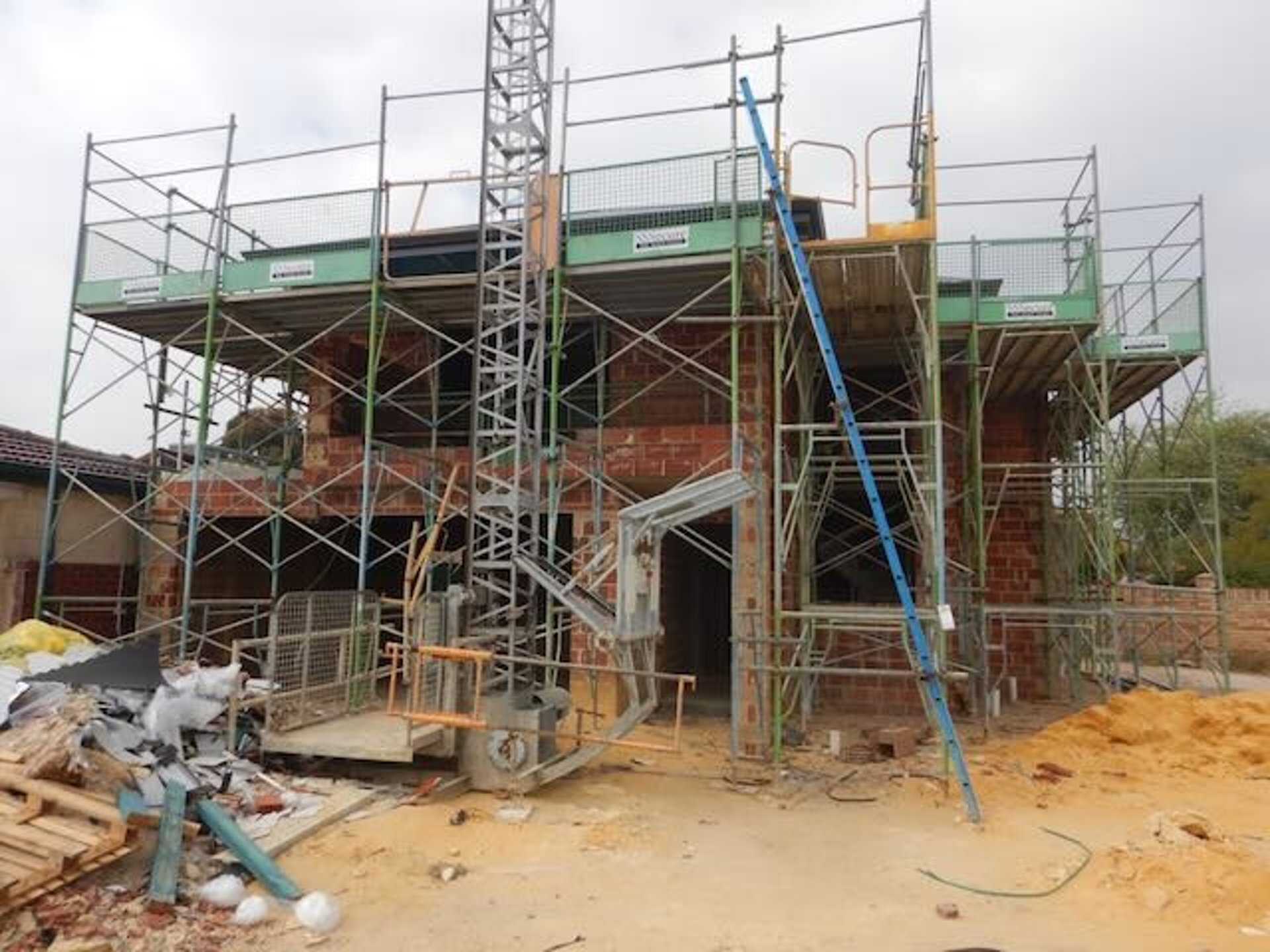 woman wearing yellow long-sleeved dress under white clouds and blue sky during daytime