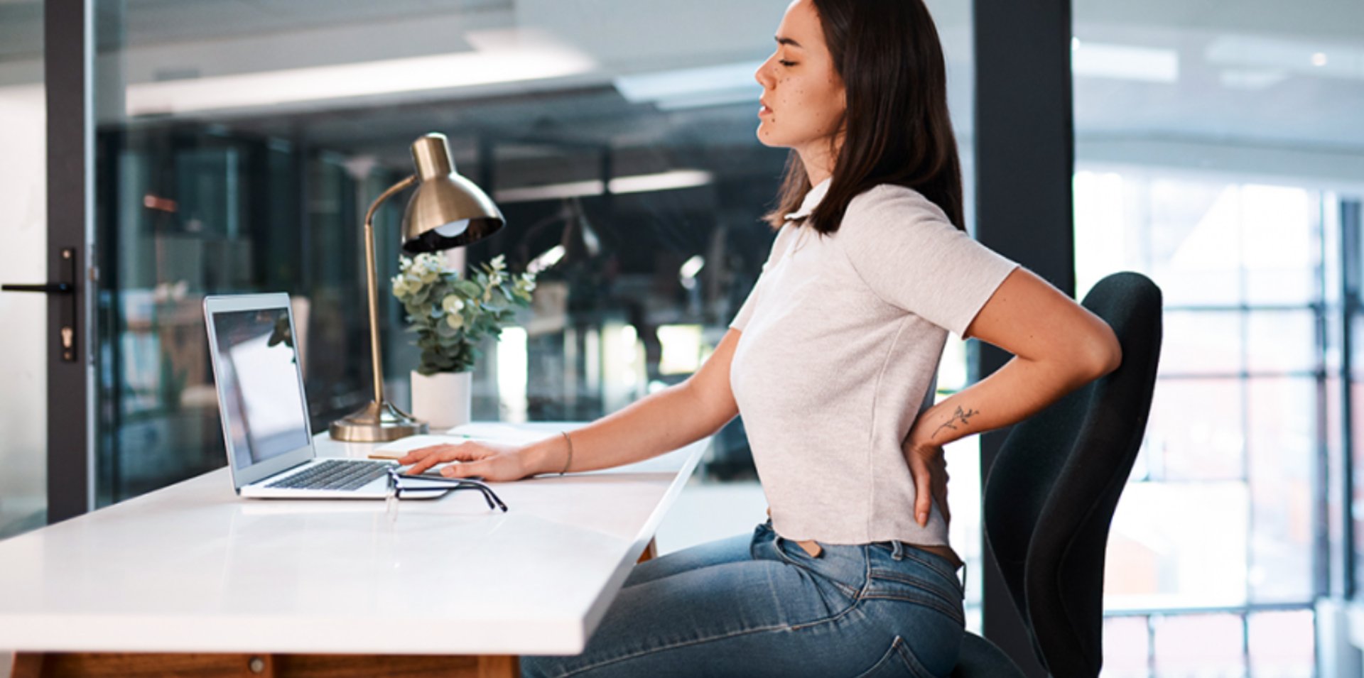 Woman is relaxing and comfortably in a chair.