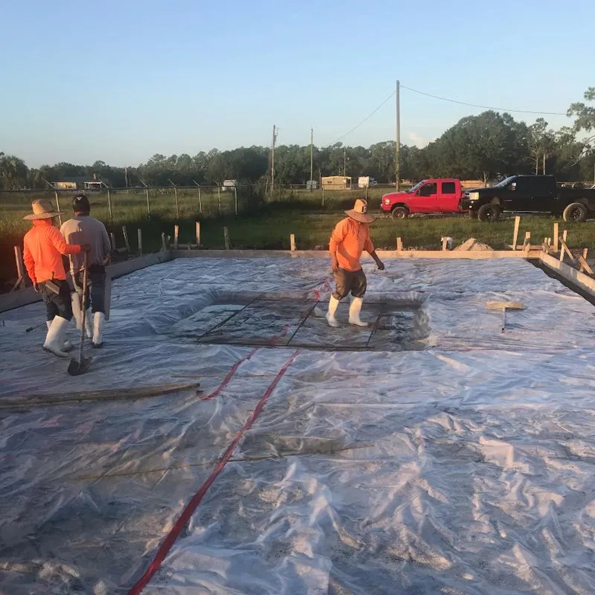 a man standing next to a building under construction
