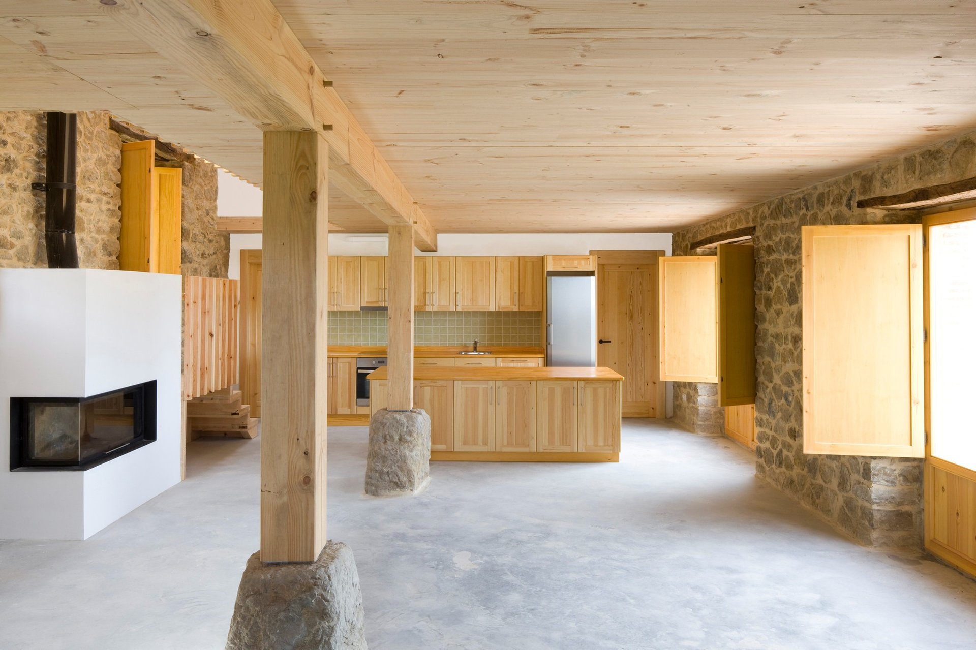 an abstract photo of a curved building with a blue sky in the background