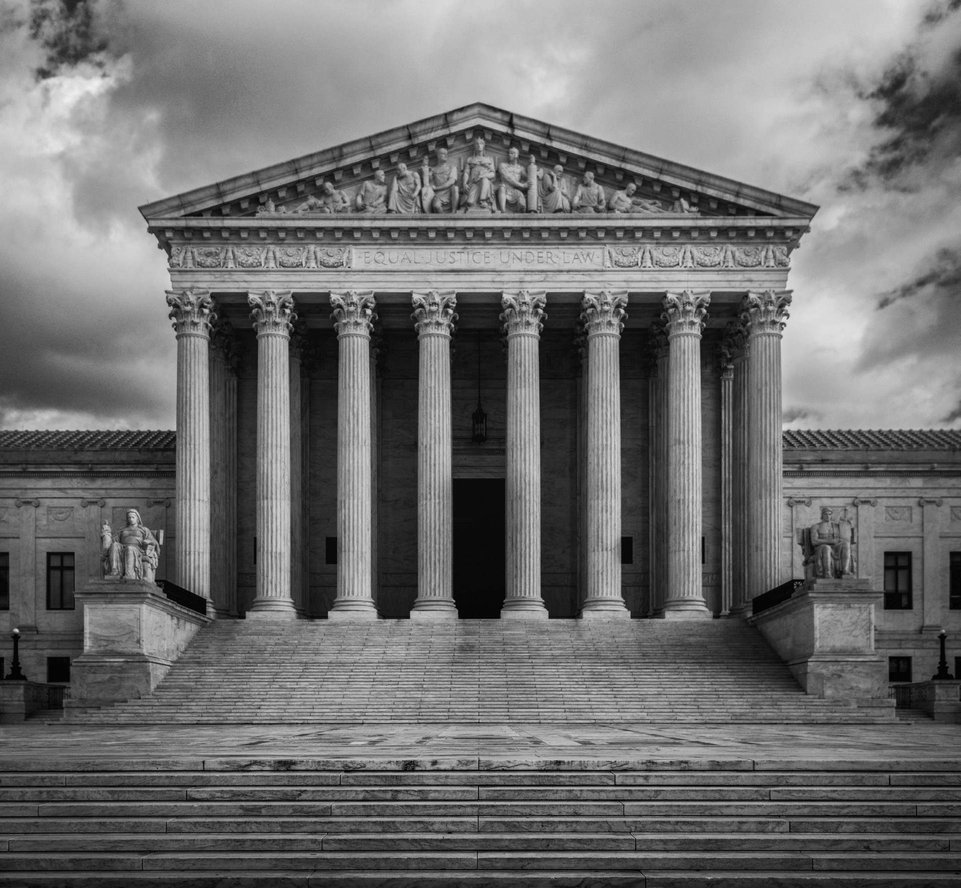a black and white photo of the supreme court