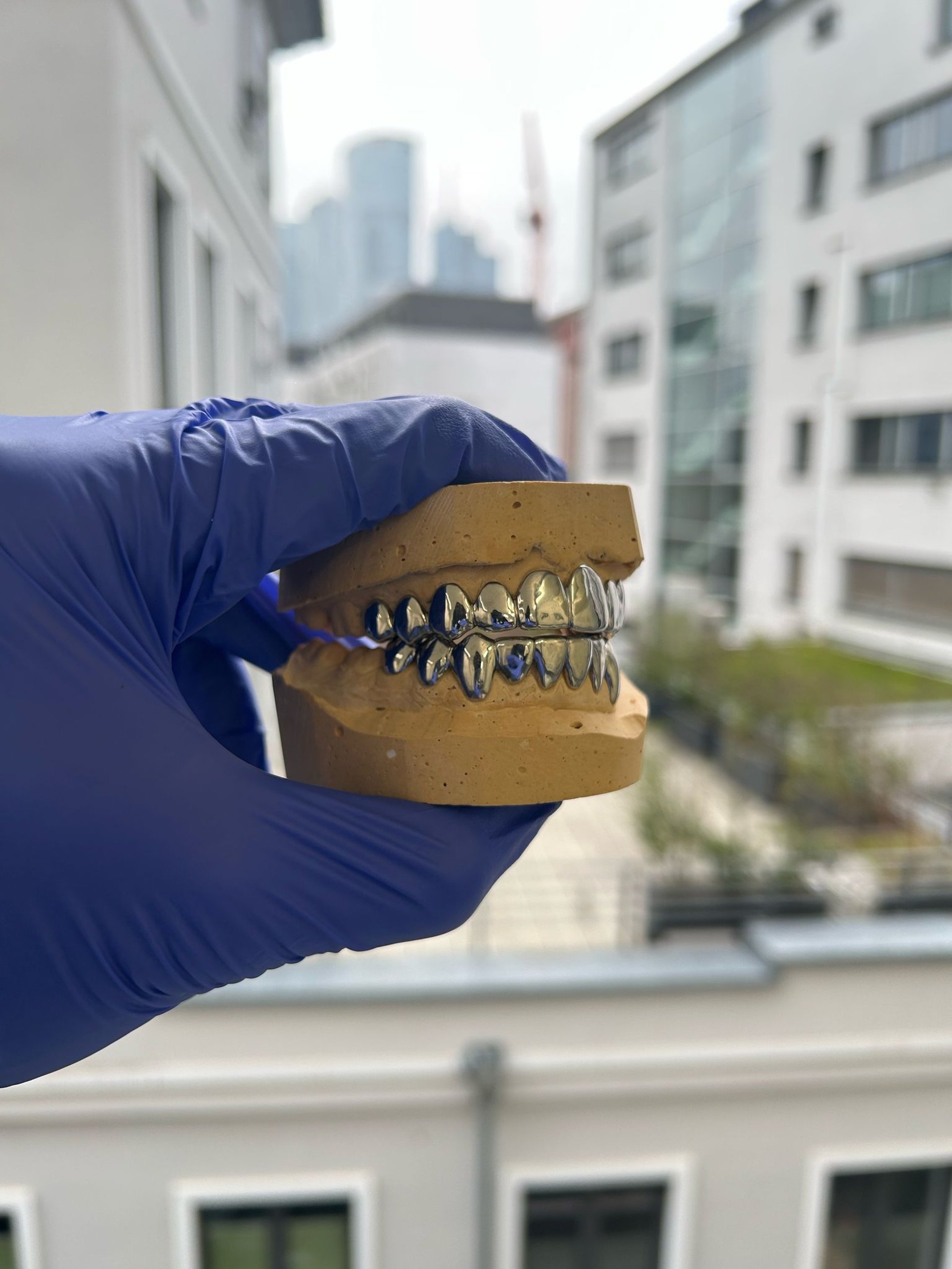 an abstract photo of a curved building with a blue sky in the background