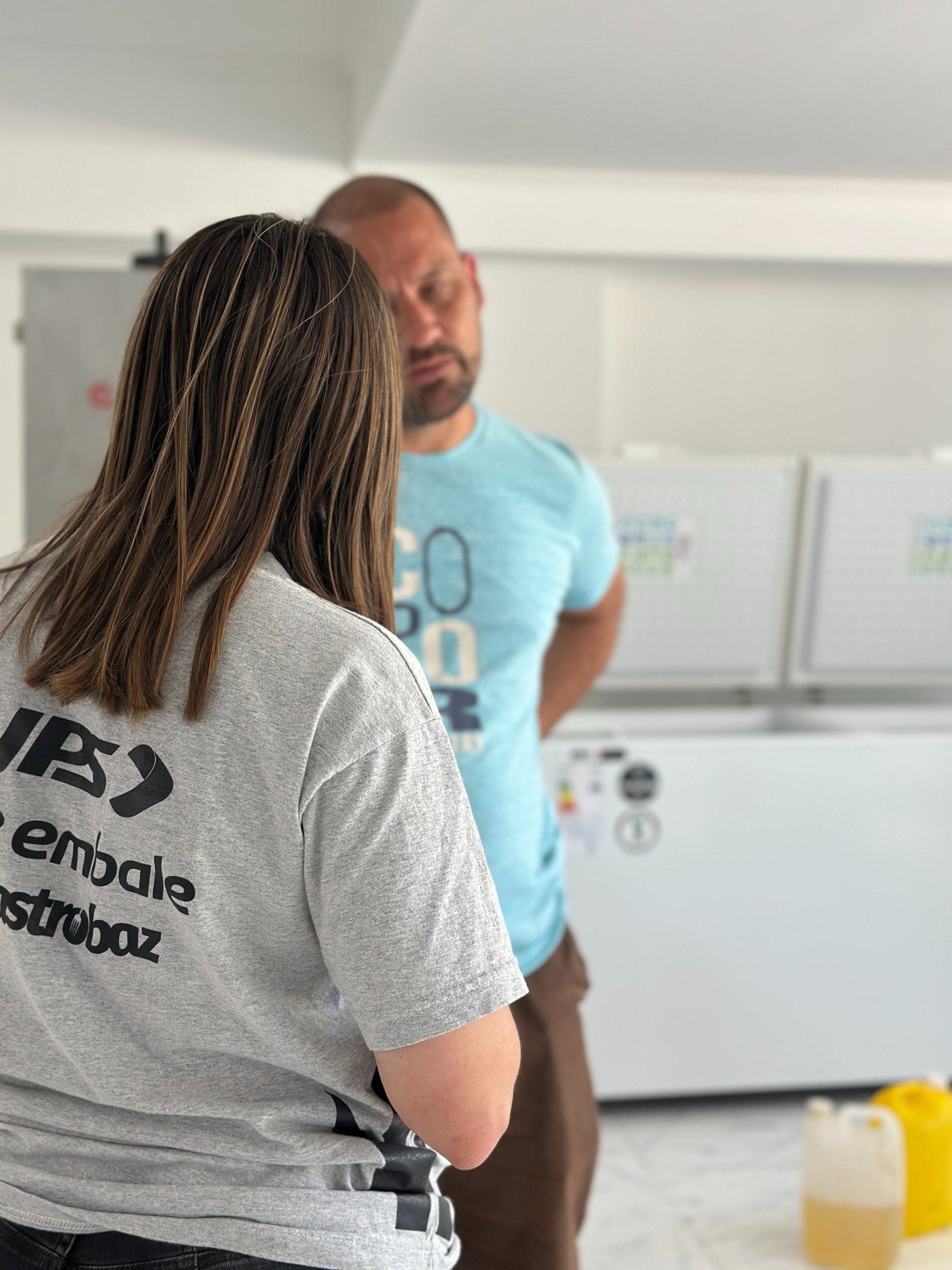 an abstract photo of a curved building with a blue sky in the background