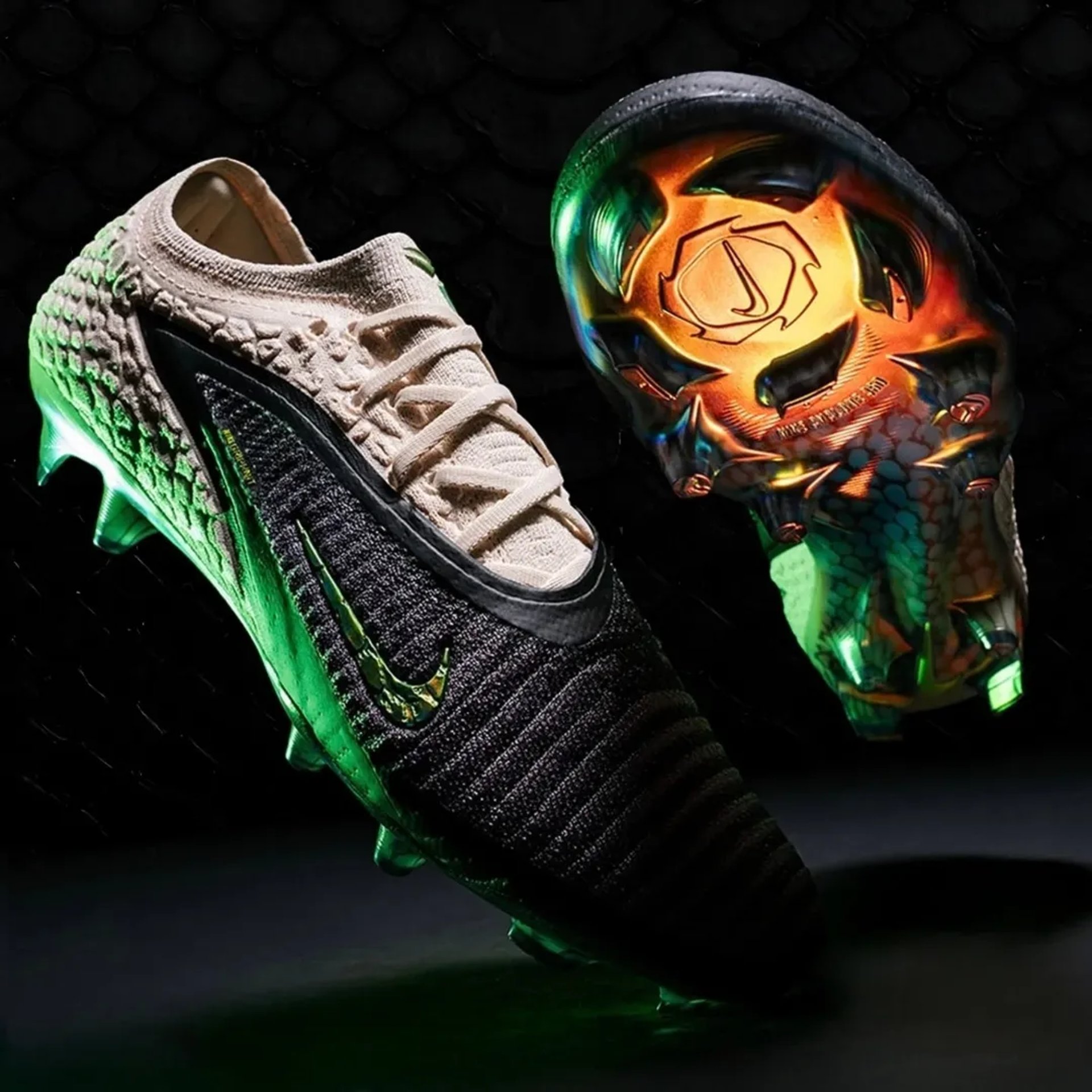 a pair of black and gold shoes on a black surface