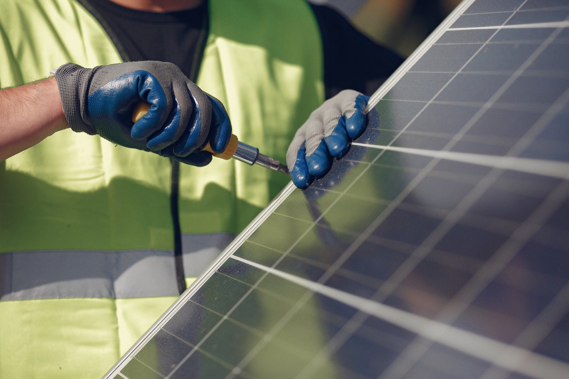 a person working on a solar panel