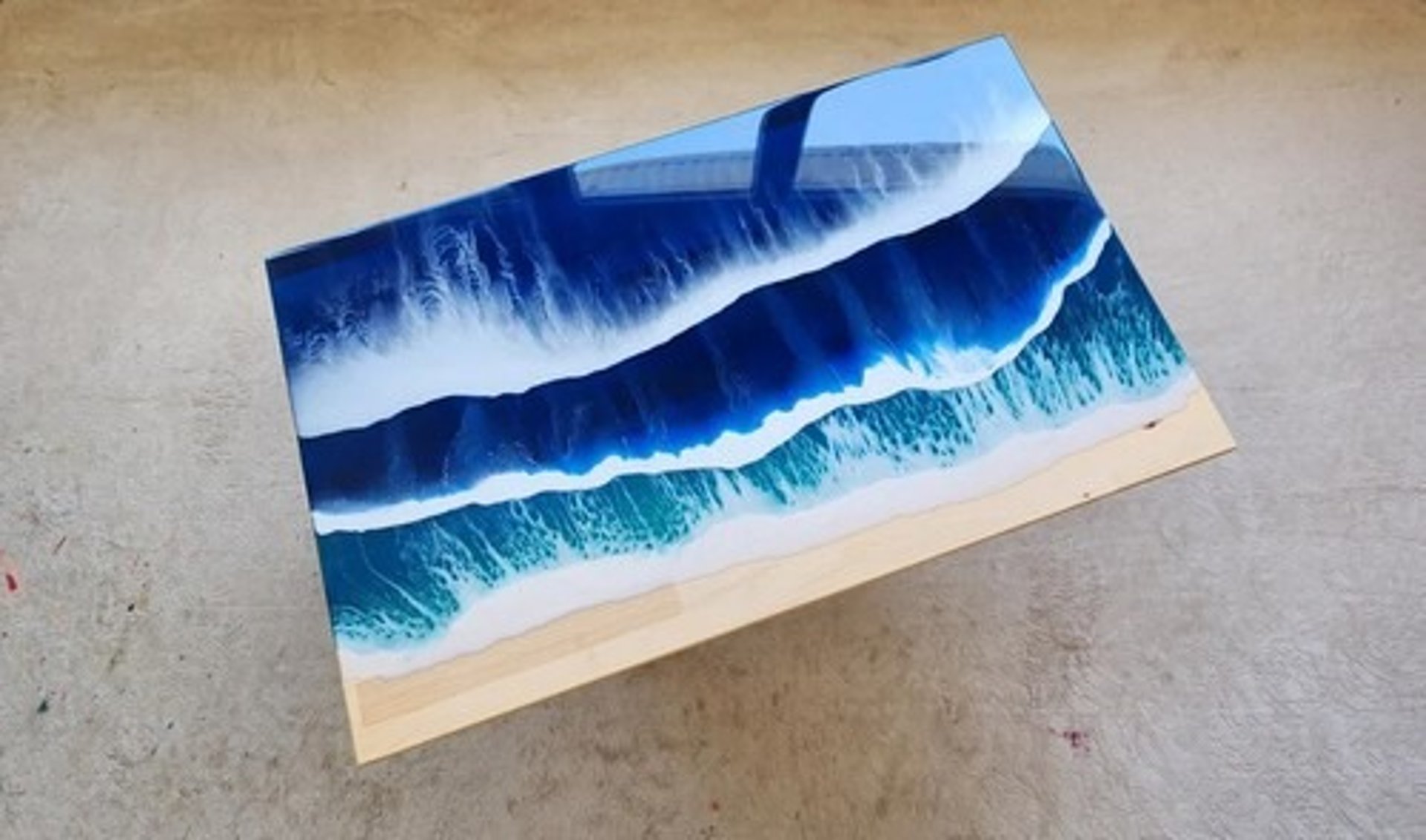 an abstract photo of a curved building with a blue sky in the background