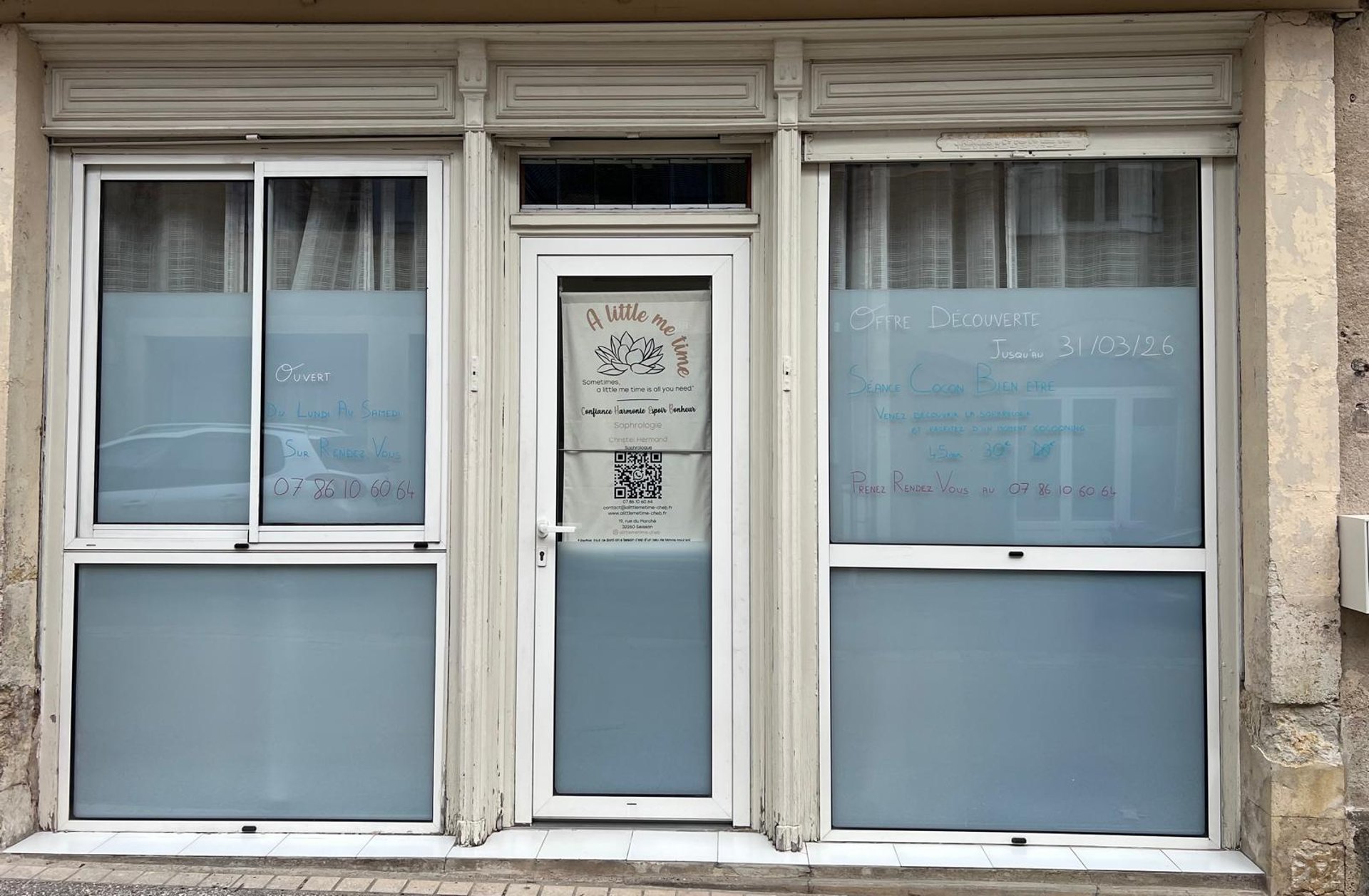 a room with a glass door that has a plant in it
