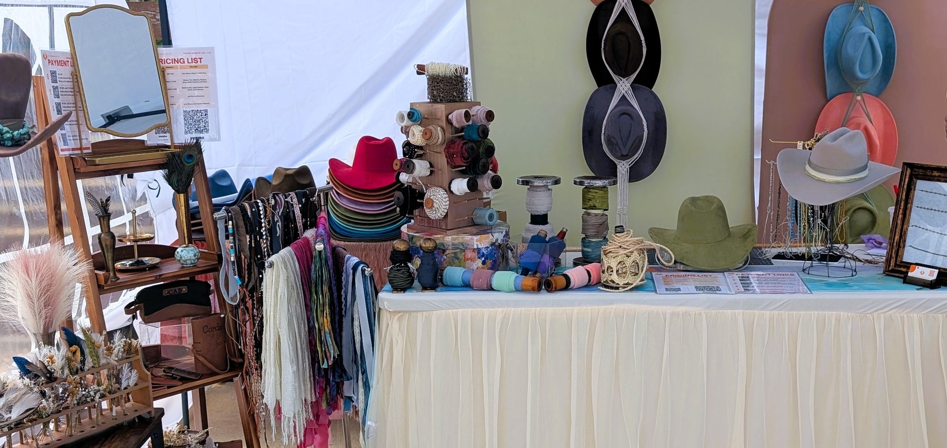 Cowboy hats hanging neatly on a wall.