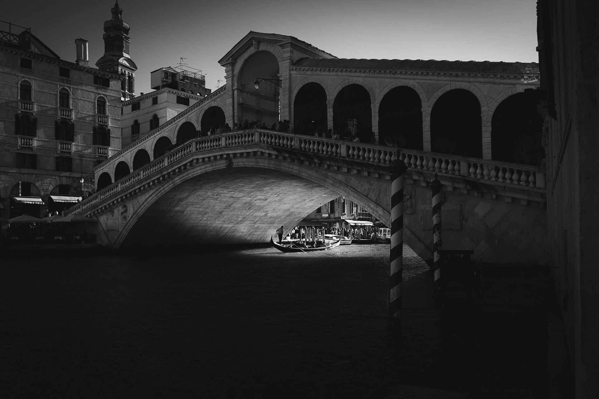 an abstract photo of a curved building with a blue sky in the background