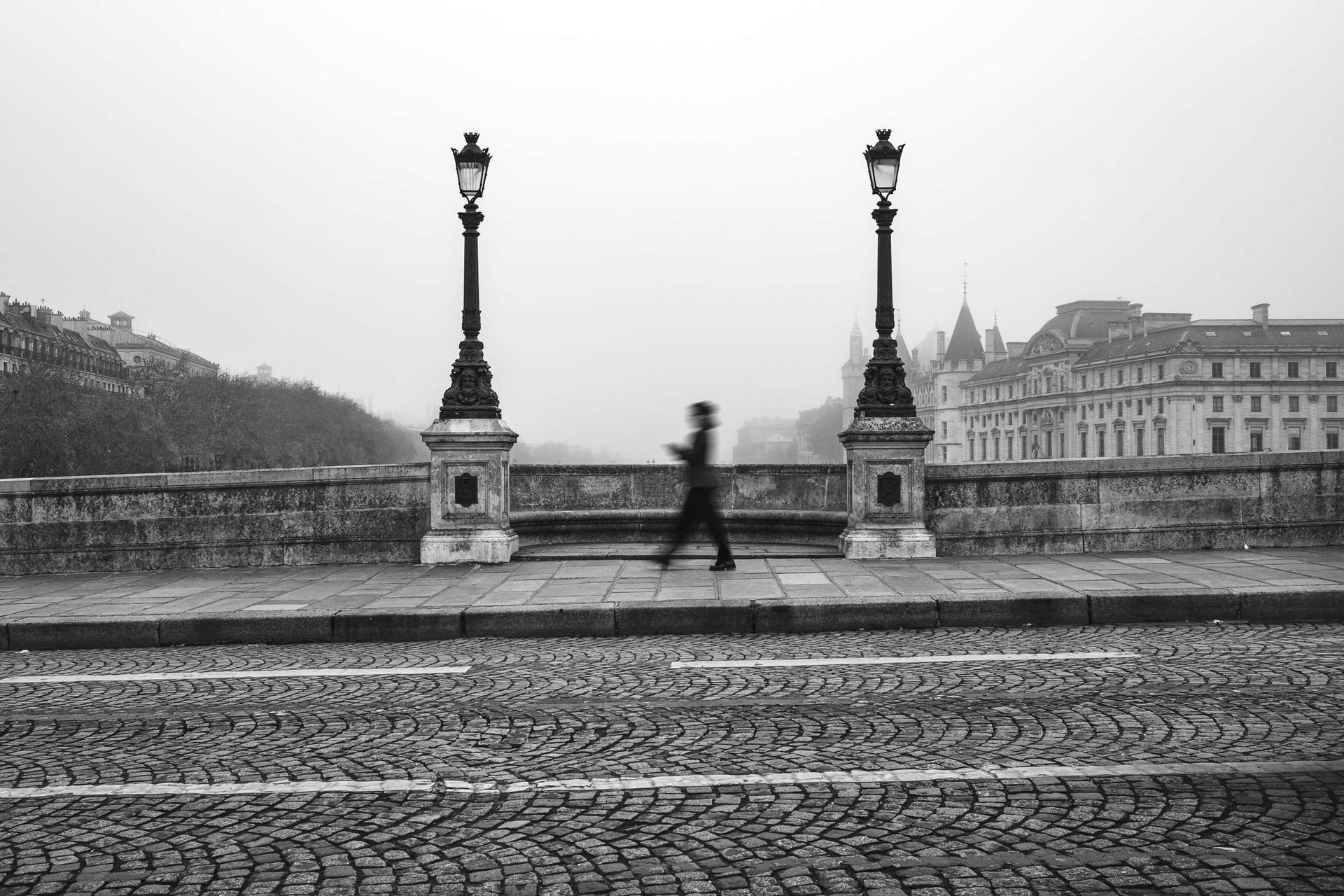 an abstract photo of a curved building with a blue sky in the background