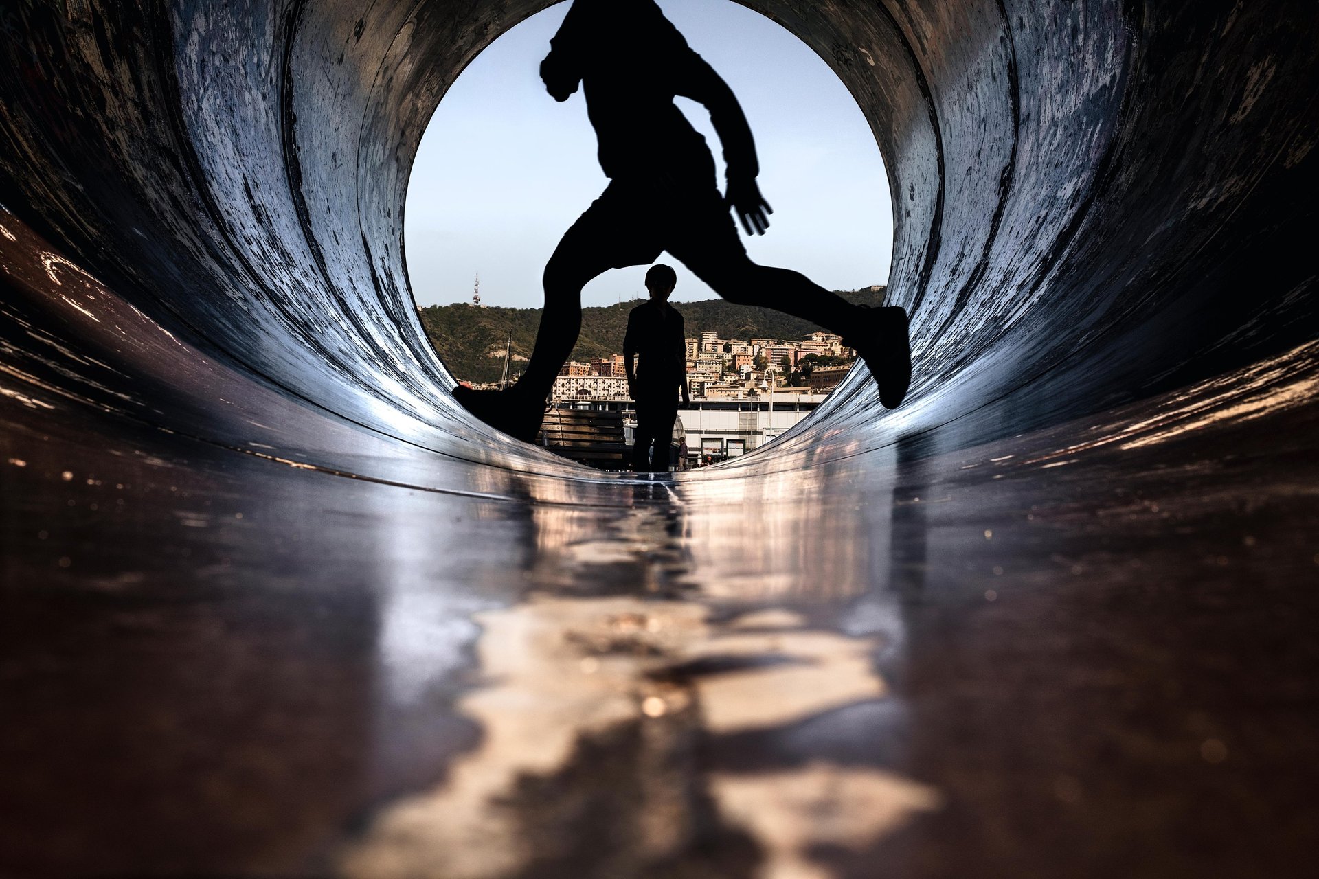 an abstract photo of a curved building with a blue sky in the background