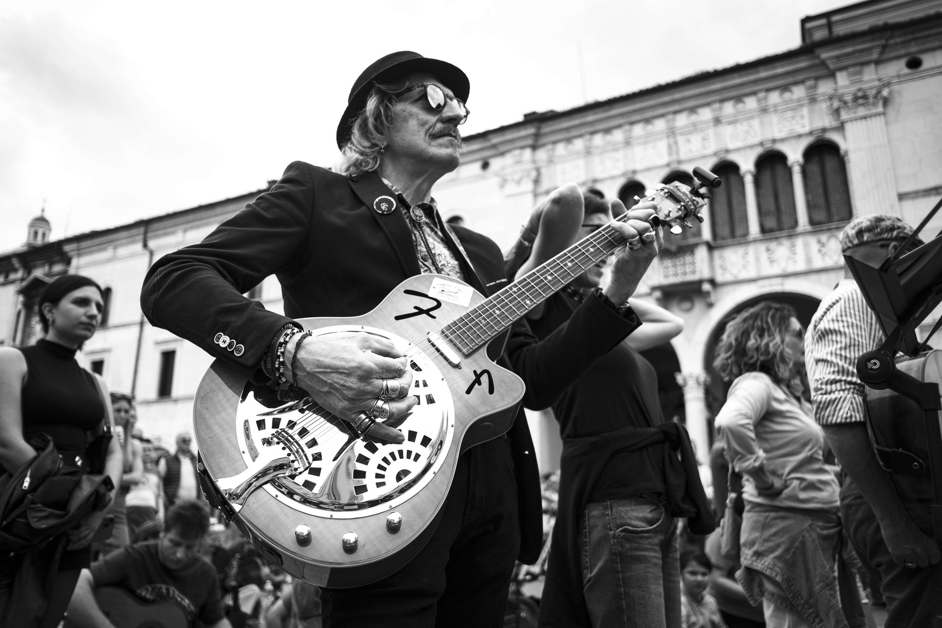 an abstract photo of a curved building with a blue sky in the background
