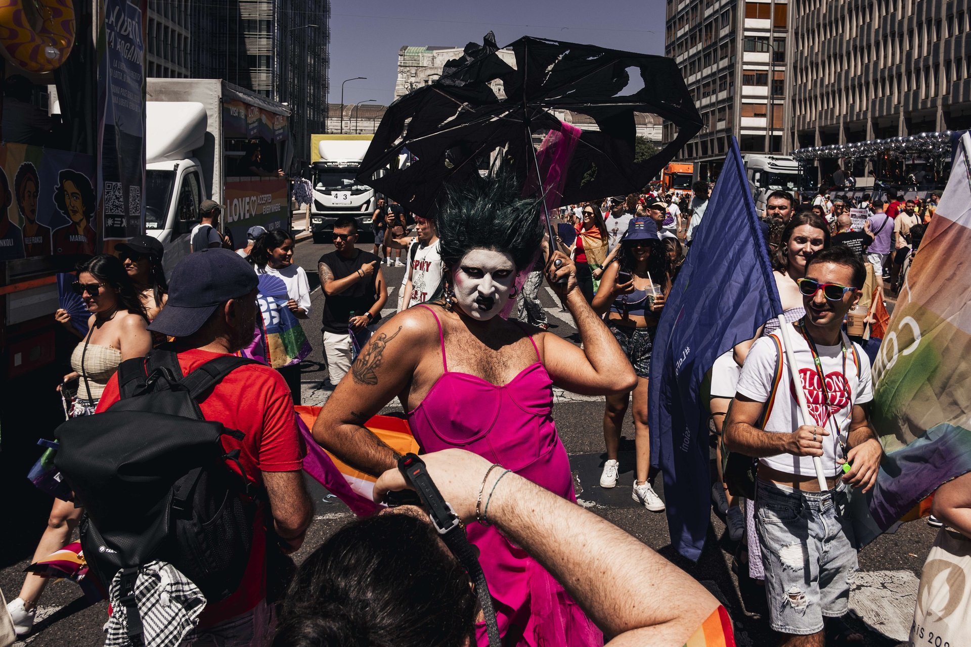 an abstract photo of a curved building with a blue sky in the background