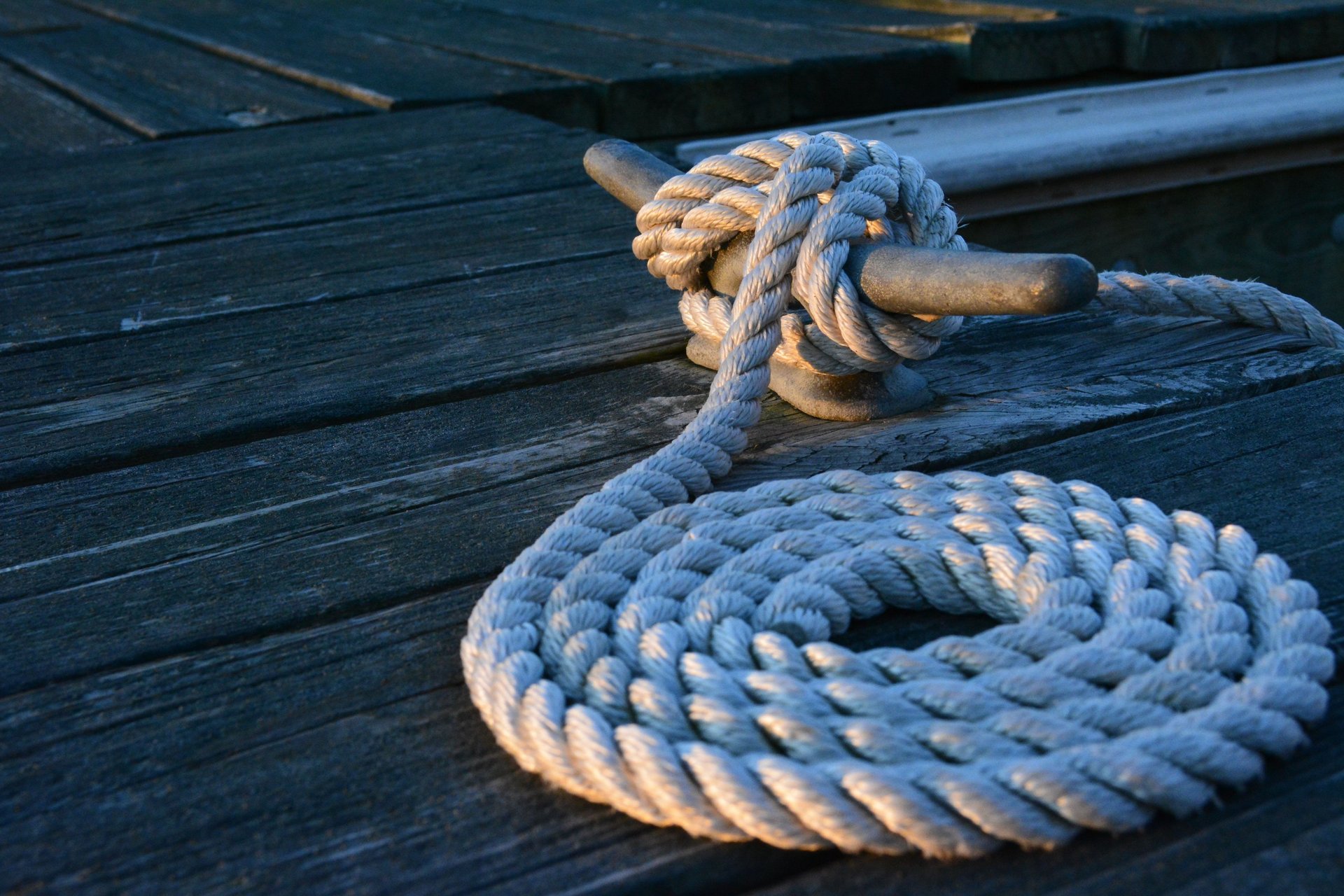 A close up of a steering wheel on a boat