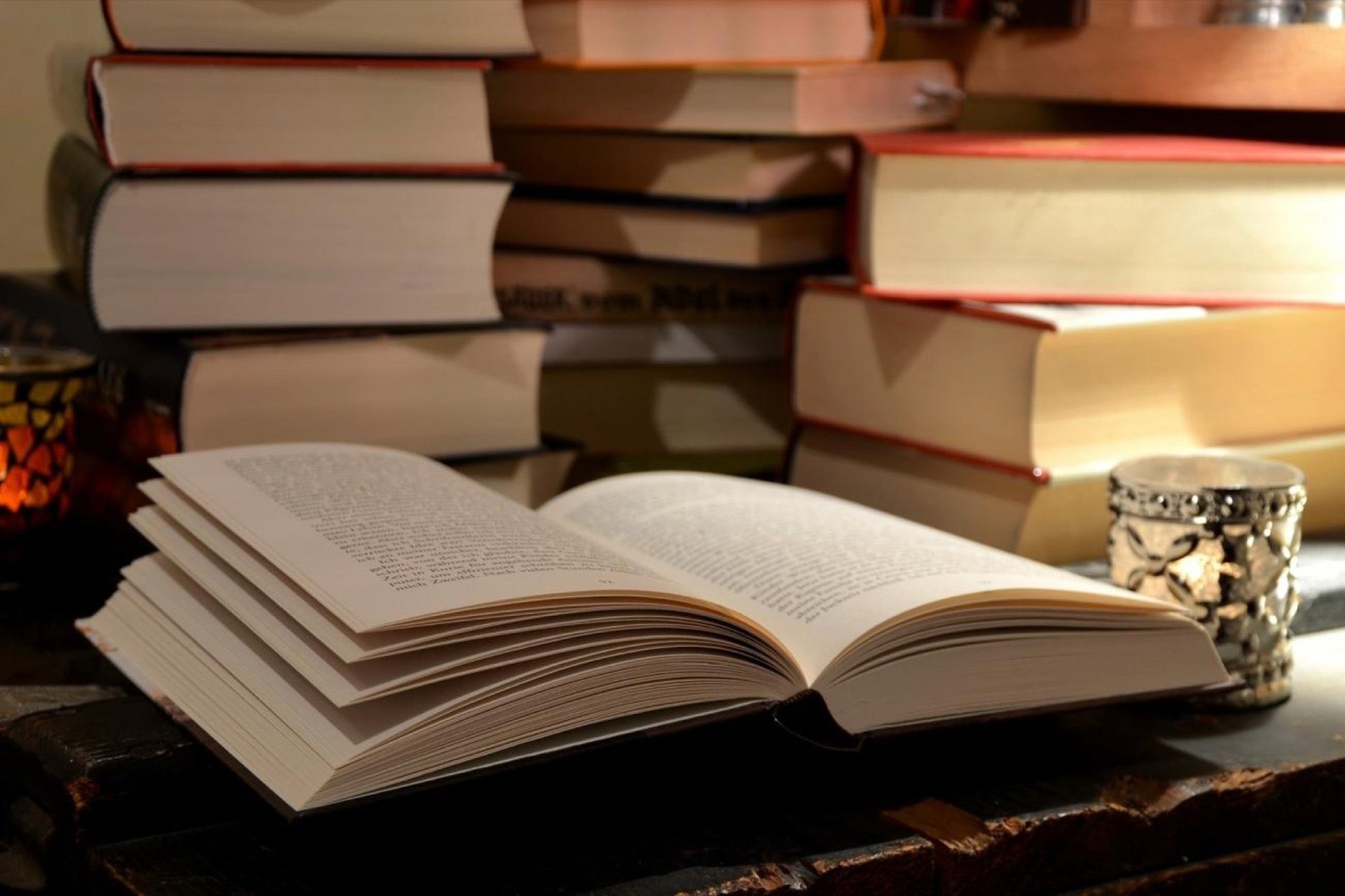 Open Book and a stack of other books