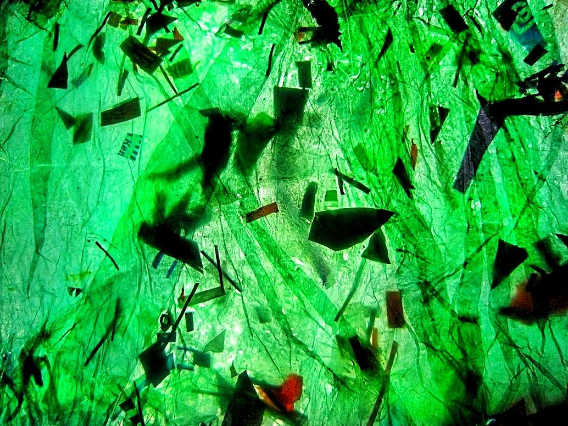 Image of green recycled plastic ironed  with black sprinkle 