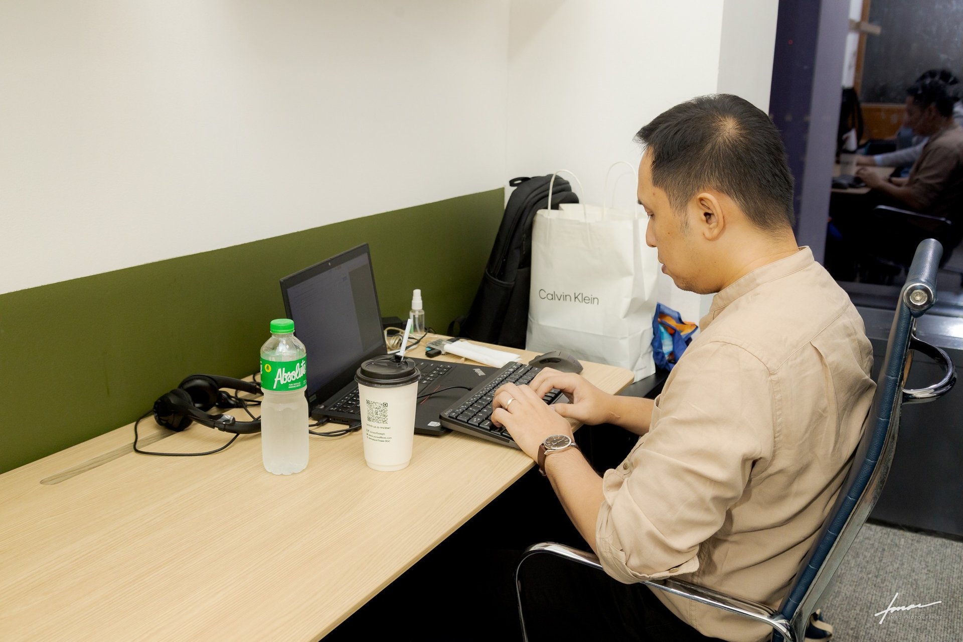 man in blue dress shirt beside man in white dress shirt