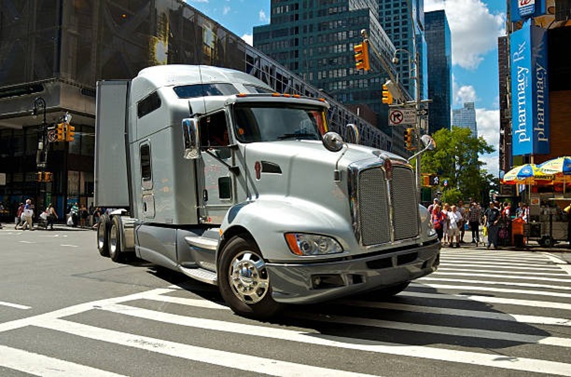 white freight truck on road during daytime