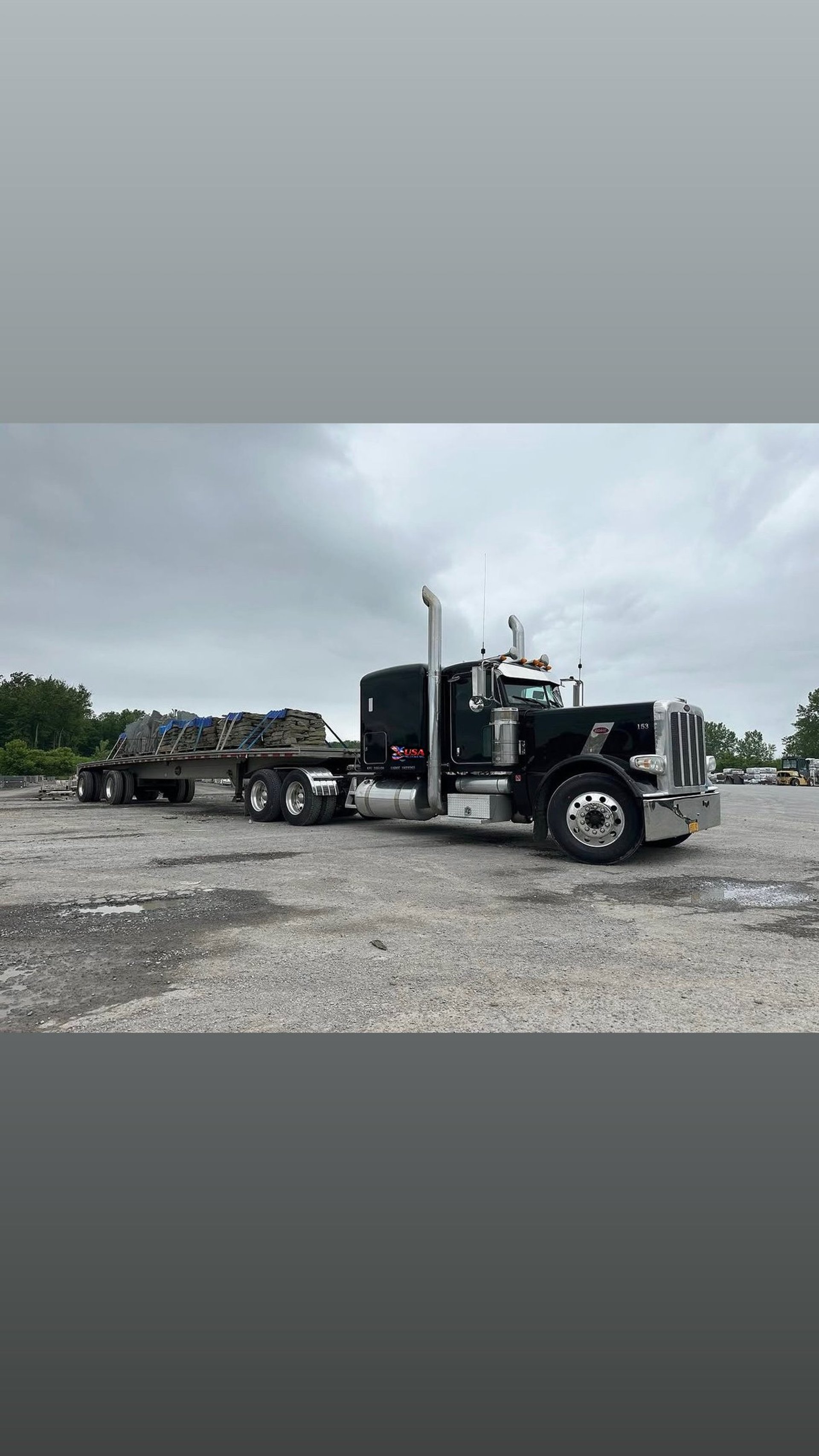 white freight truck on road during daytime