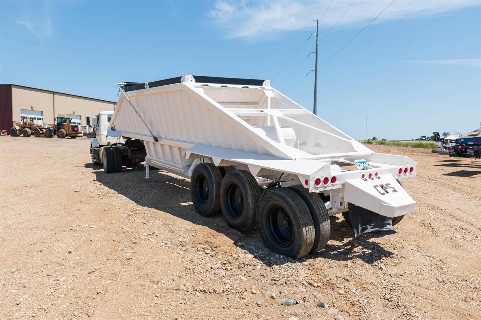 white truck on gray road during daytime