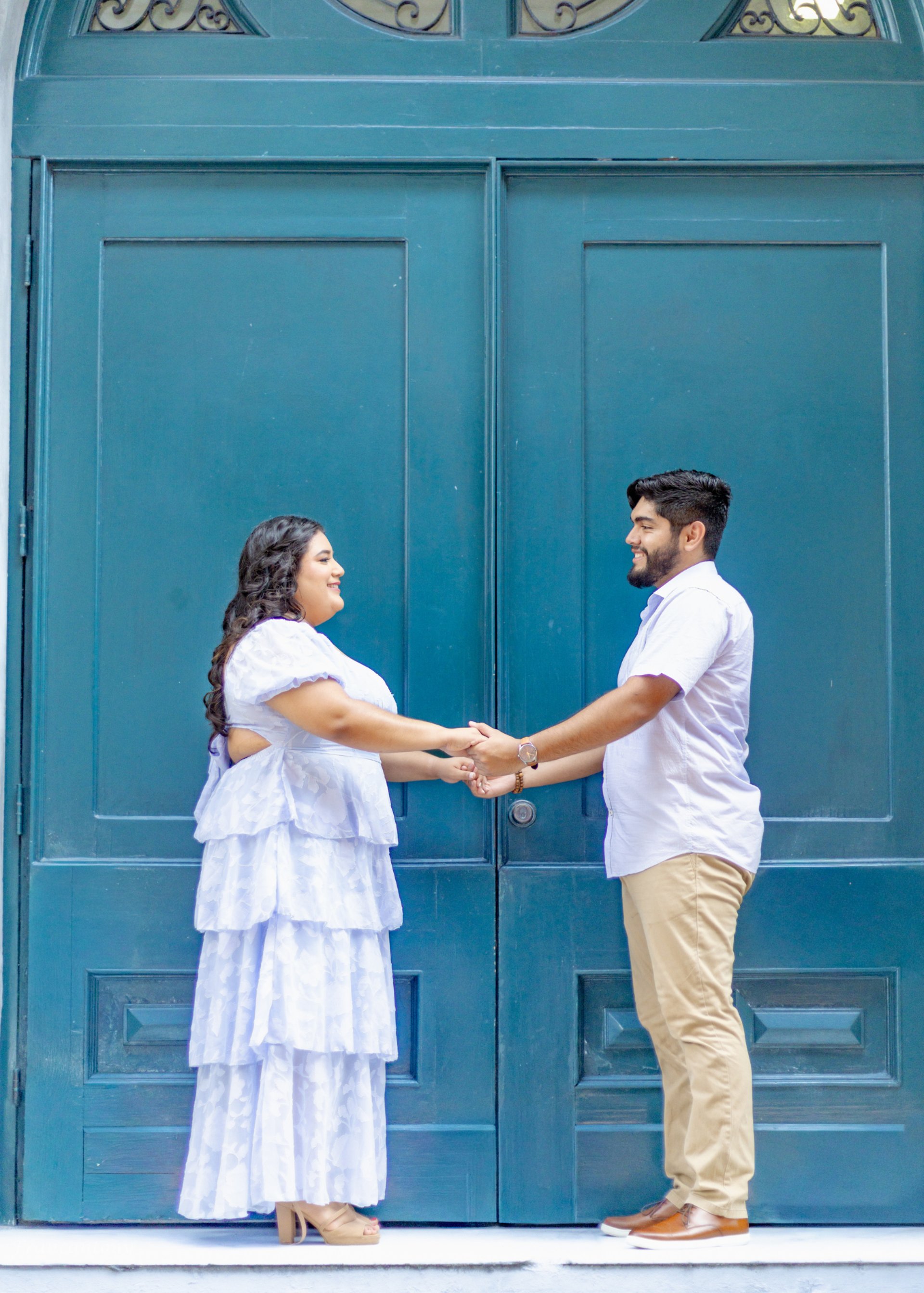 an abstract photo of a curved building with a blue sky in the background