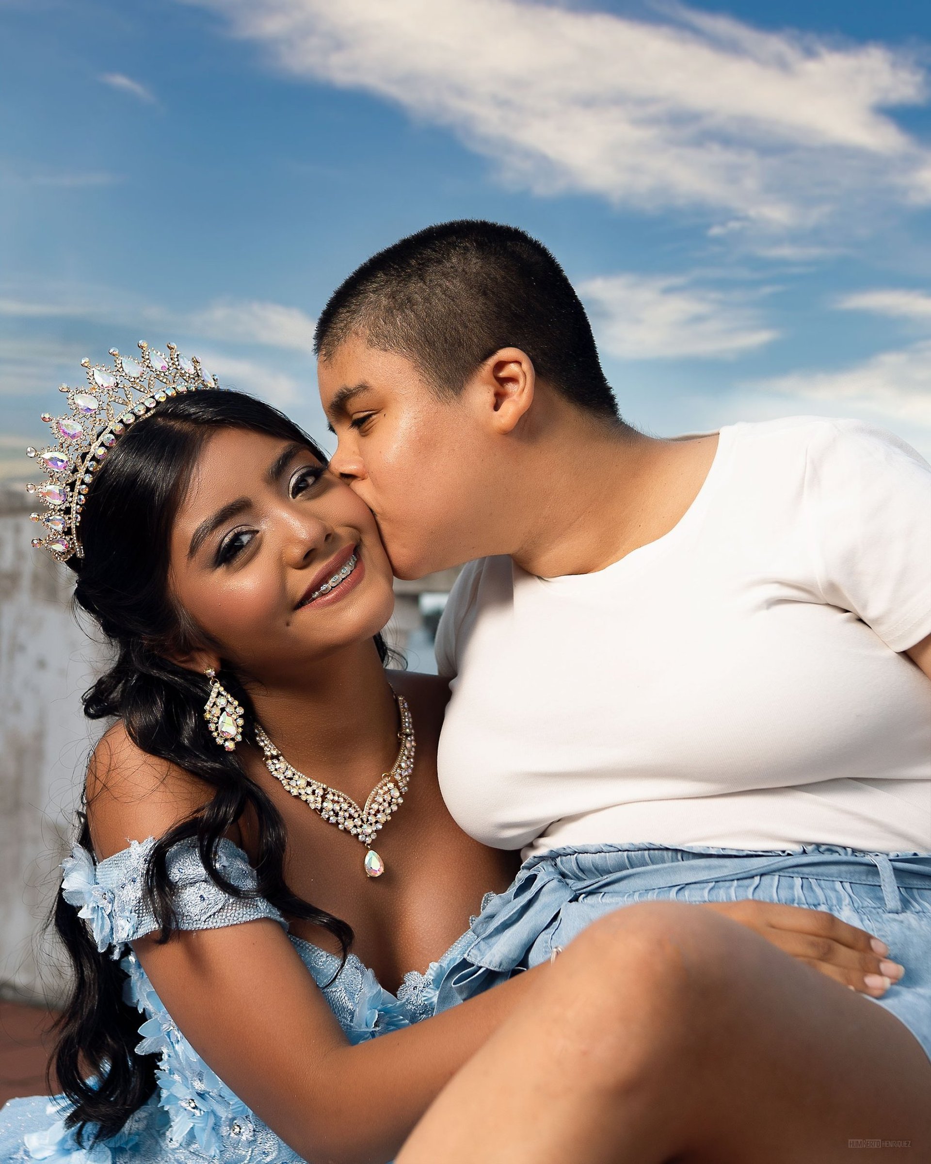 an abstract photo of a curved building with a blue sky in the background