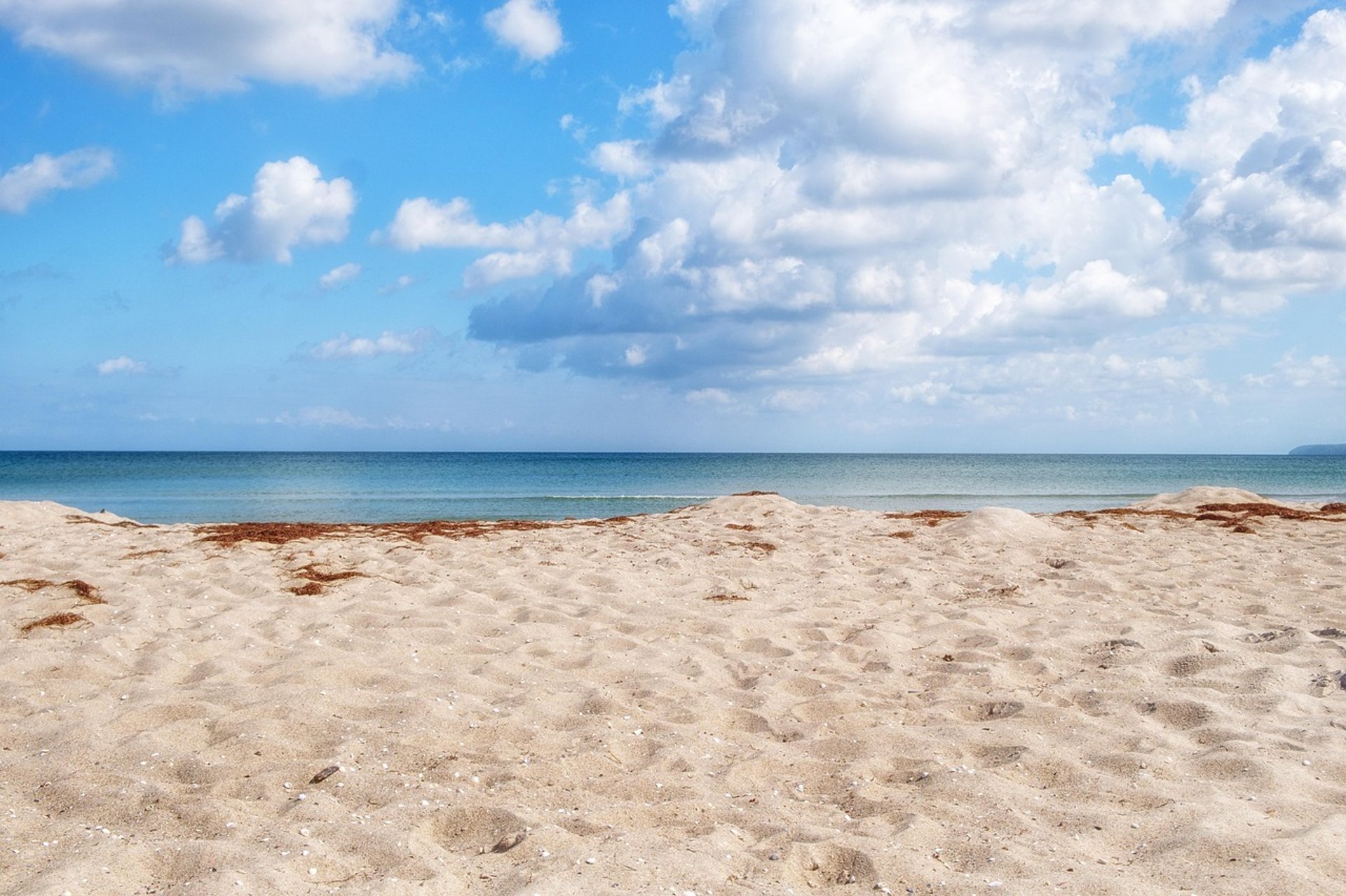 an abstract photo of a curved building with a blue sky in the background