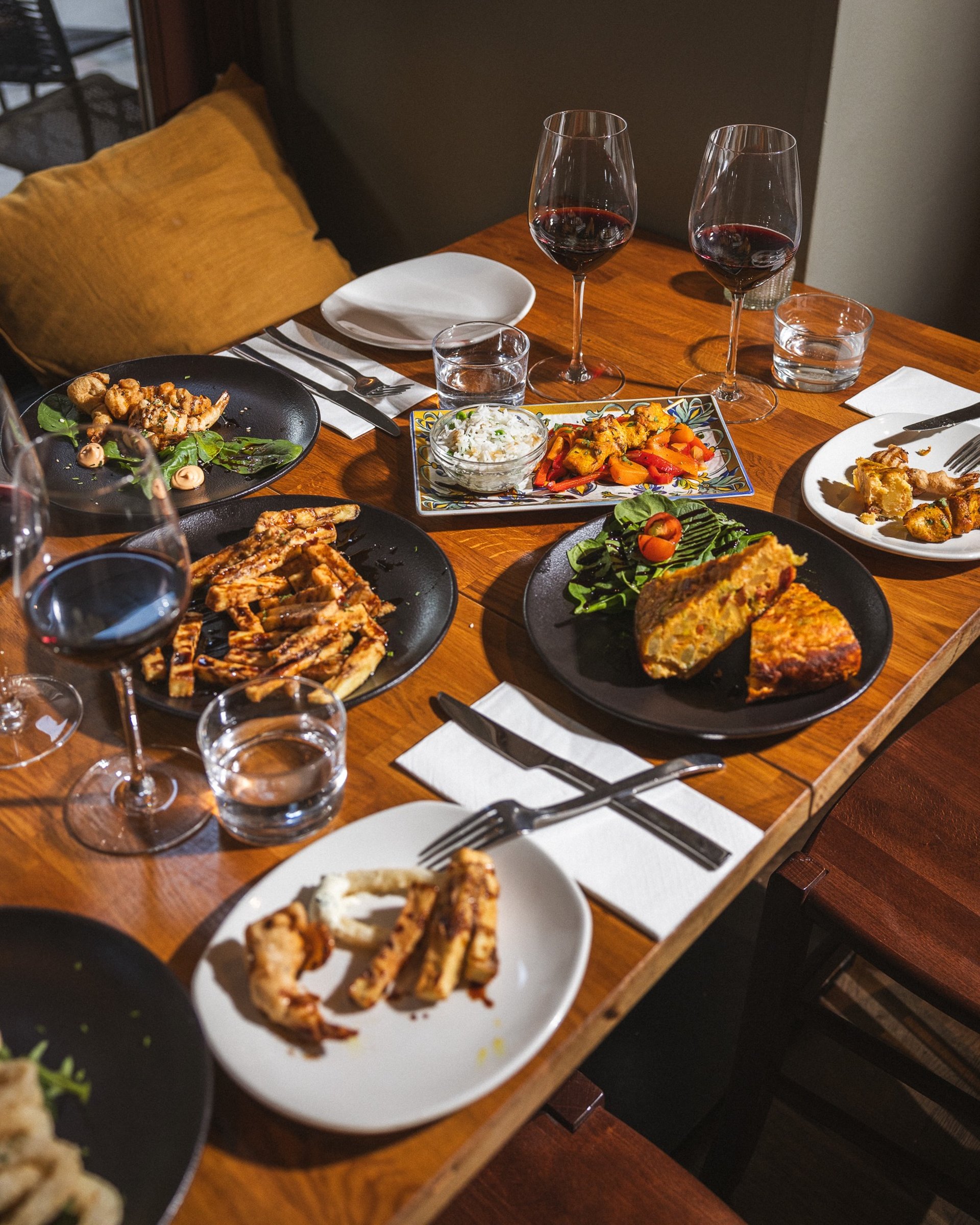 an abstract photo of a curved building with a blue sky in the background